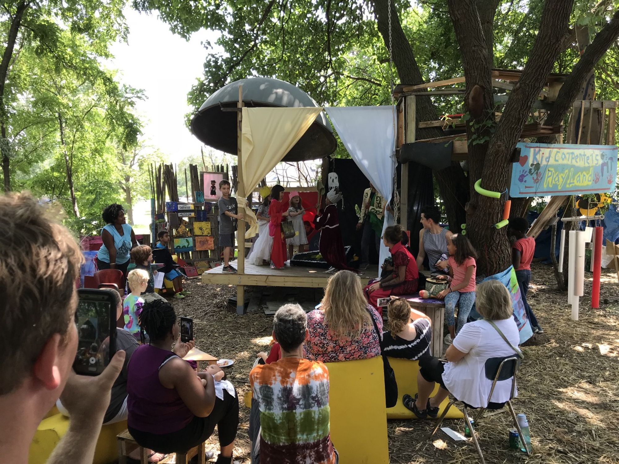 Camp Carpenter in action! Kids perform on an outdoor stage. 