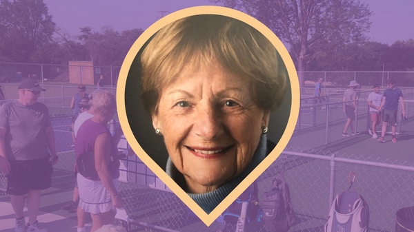 A headshot of Sue Mills against the backdrop of the Patriarche Park pickleball courts.