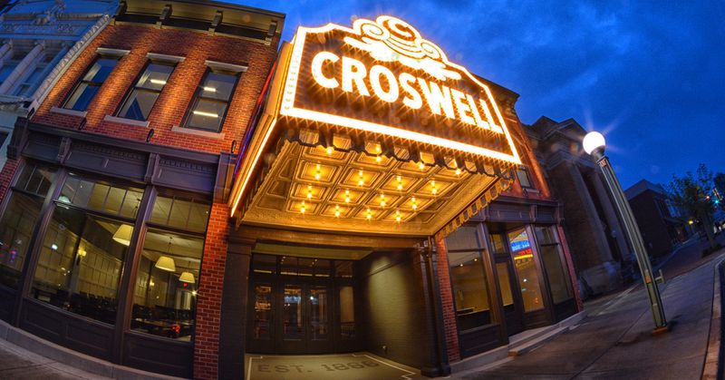 The Croswell Opera House with a lighted marquee 