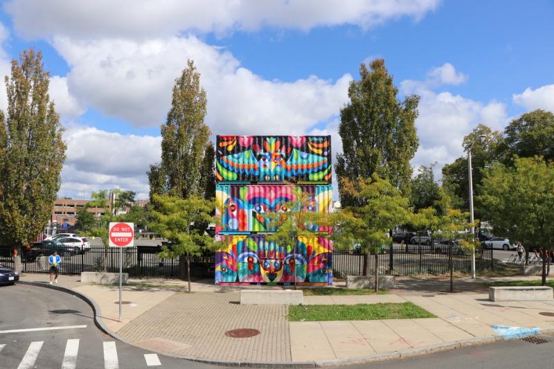 Art installation featuring murals activating a street corner.