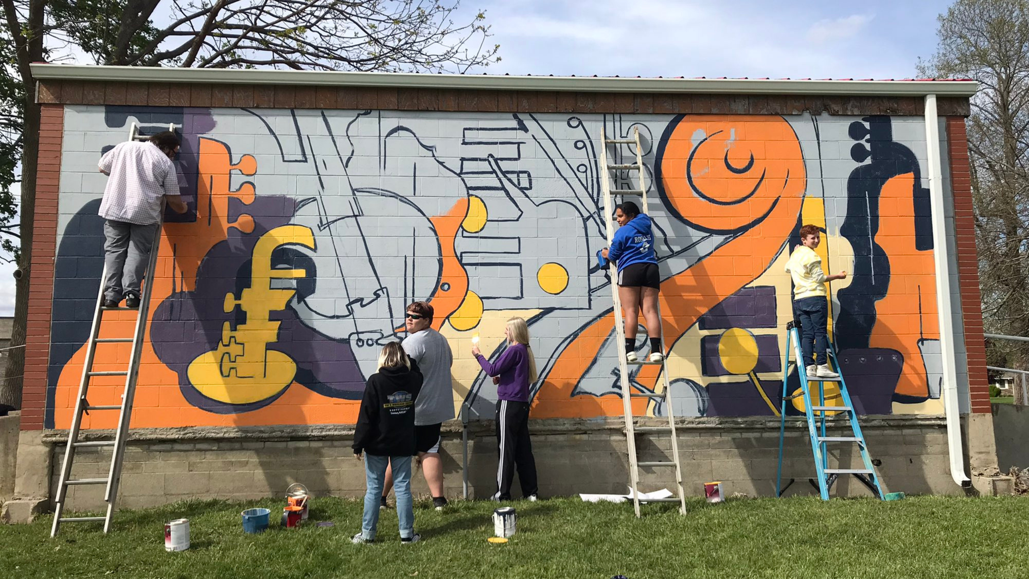 A mural of musical instruments in progress at Rebekah Park. 