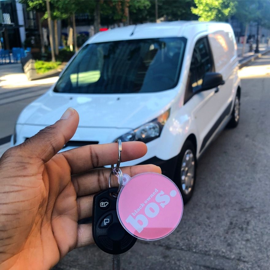 Jae'da holds the keys to her new business vehicle in her hands.