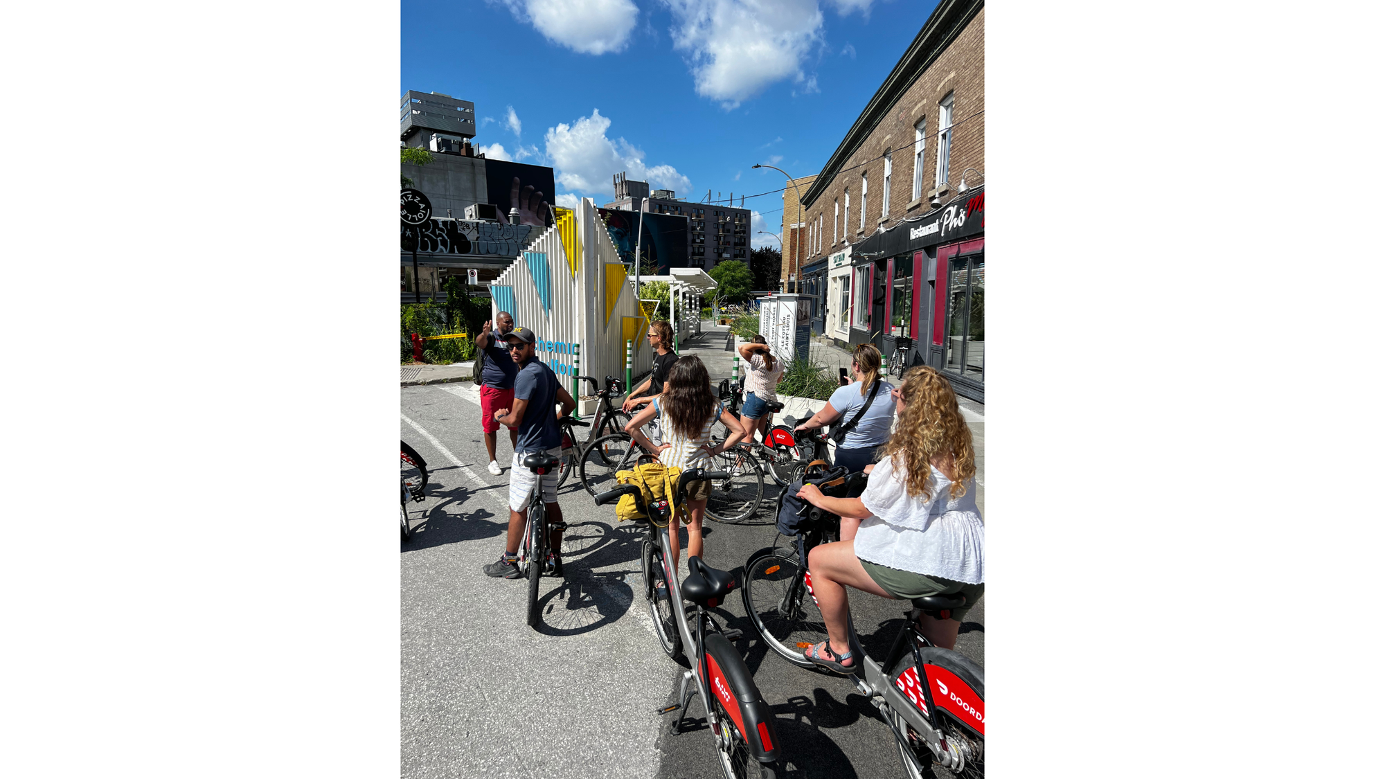 A group of people stop to discuss the bike infrastructure of the REV in Montreal.