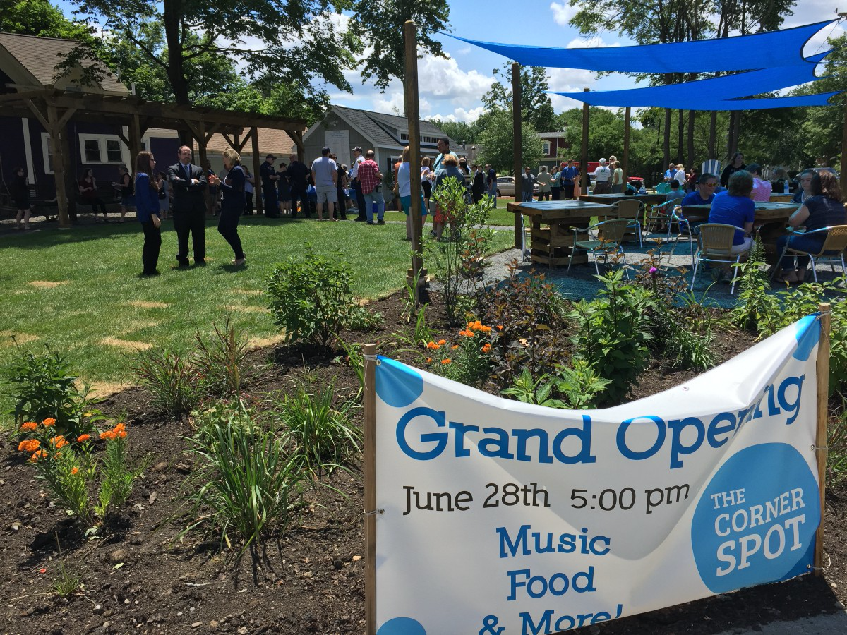 The Corner Spot in Ashland, MA with welcoming outdoor seating, shade, and landscaping.