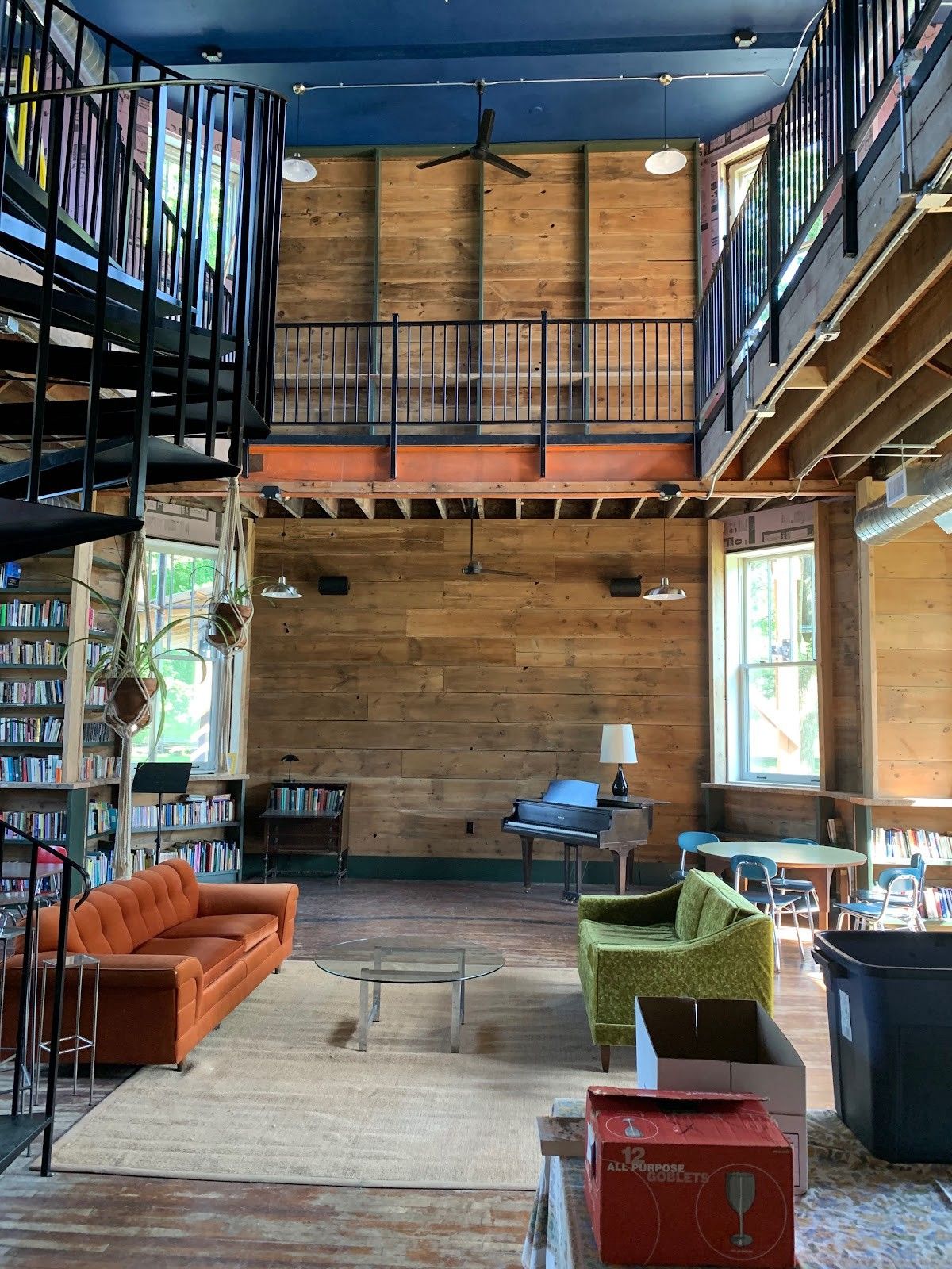 The renovated area of the former Huss School, featuring seating and exposed rafters.