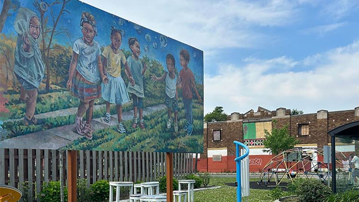 A park in the NW Goldberg Neighborhood in Detroit, Michigan, featuring public art, seating, and play space.
