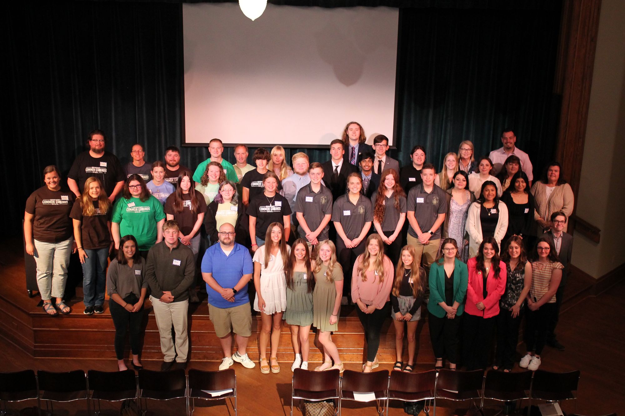 My Community, My Vision Youth Councils stand on a stage