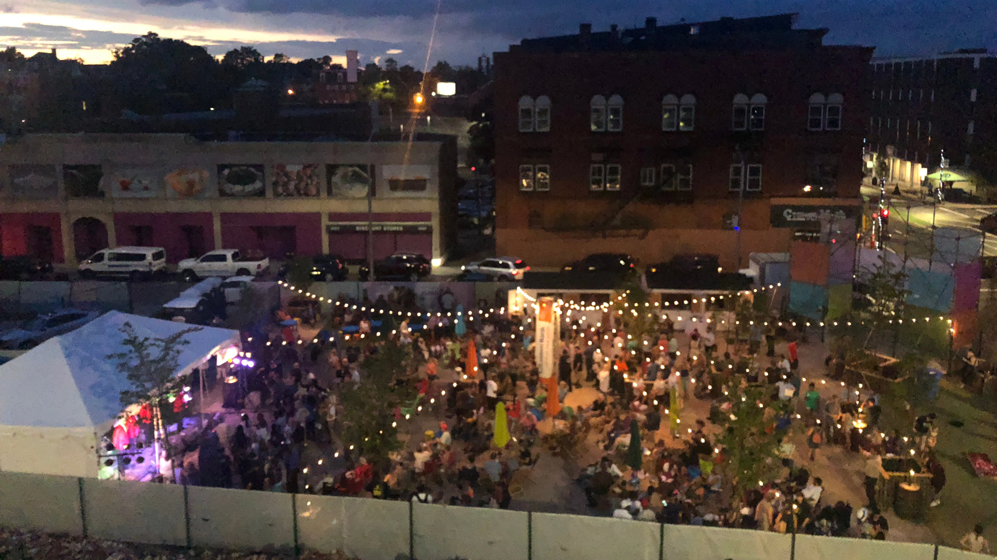 PROVA! Brockton placemaking pop-up with outdoor seating, shade umbrellas, and string lighting. Overhead view.