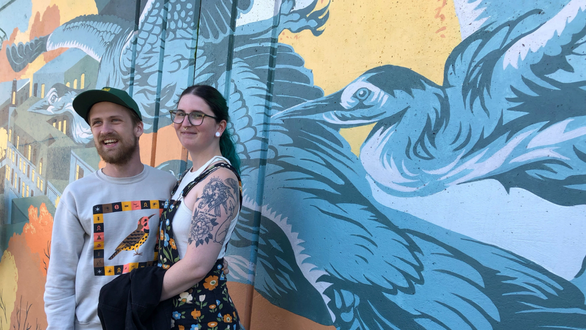 Artists Calvin Laituri (left) and Caroline Stjarnborg at the High Street Mural in Brattleboro, VT