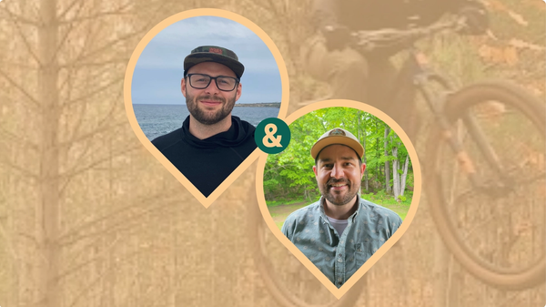 Headshots of two men within pinshape frames, with a mountain bike soaring in the background.