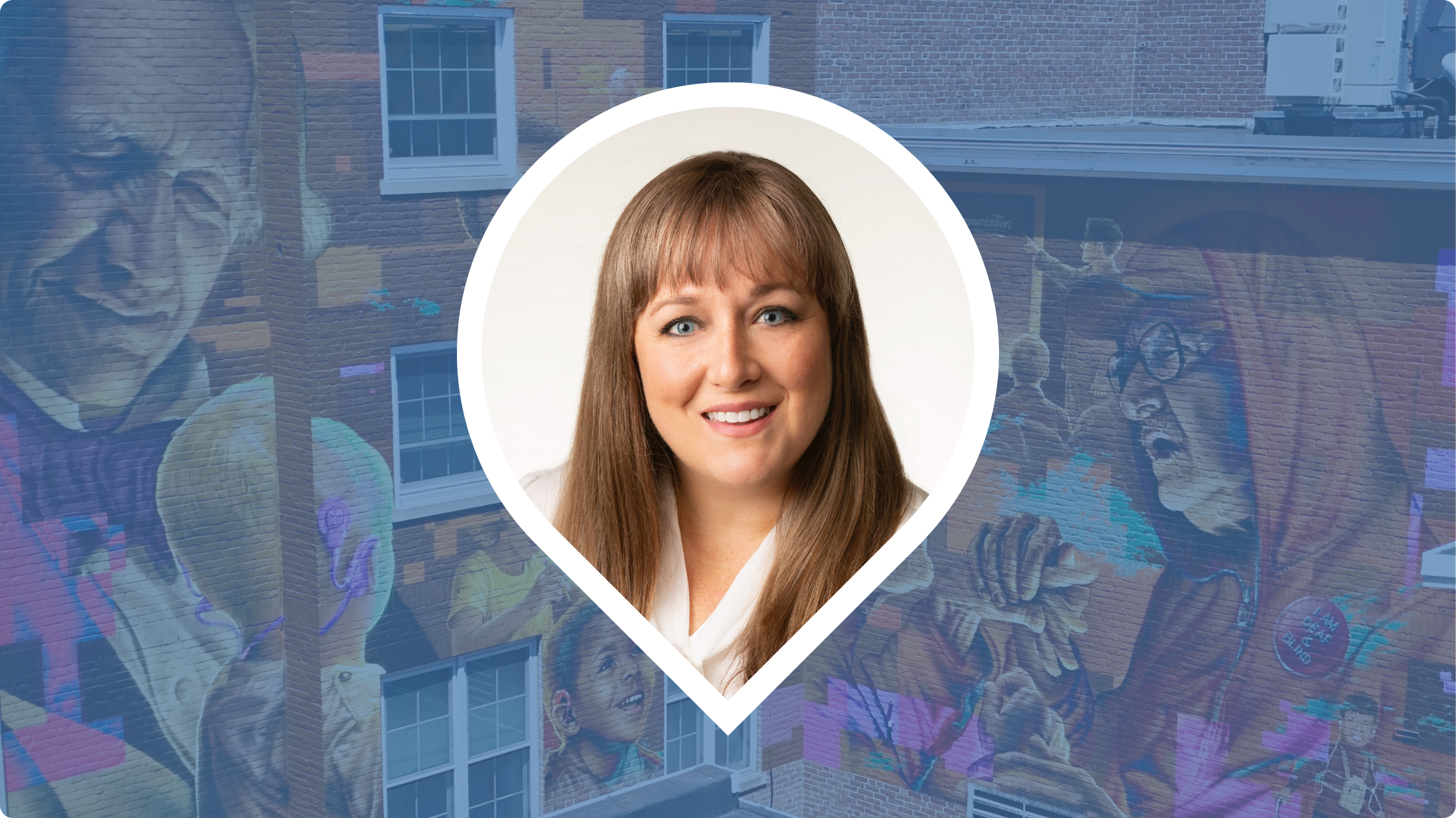 Headshot of Megan Allen within a pin icon, with a blue background masking the mural