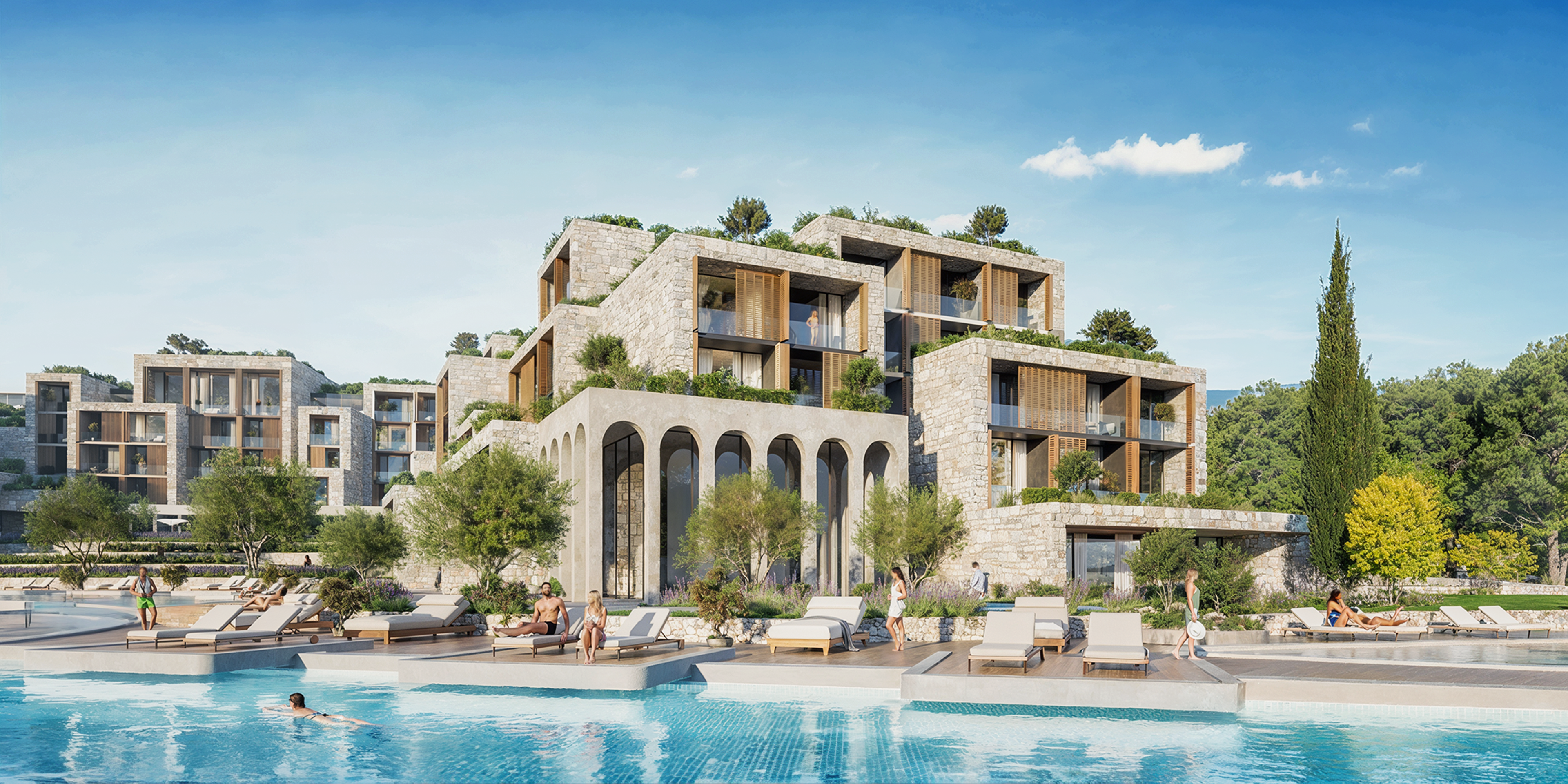 Stepped stone and timber apartment buildings with arched arcades beside a resort pool