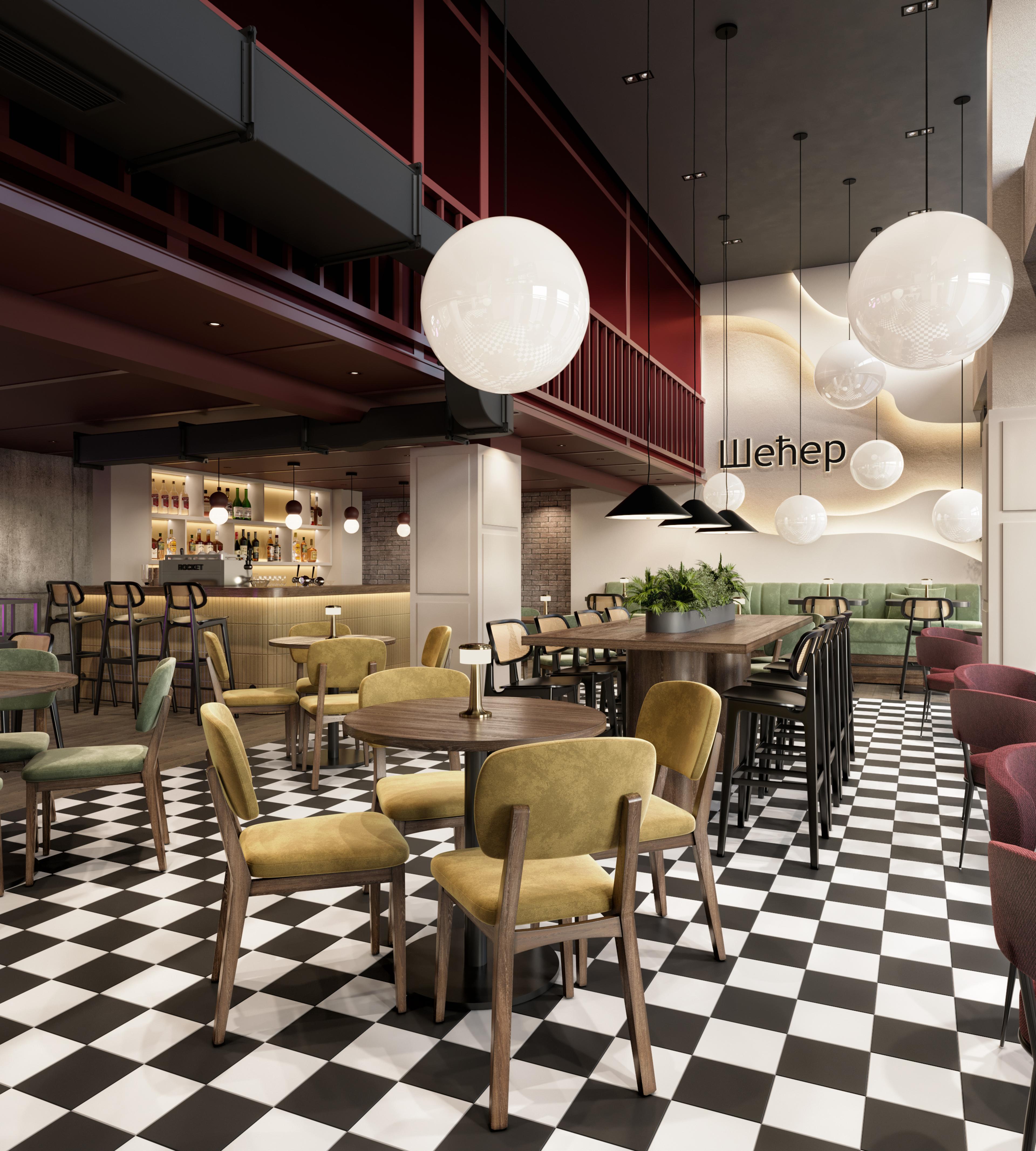 Cafe with a black and white chequered floor, mustard chairs and large globe pendants