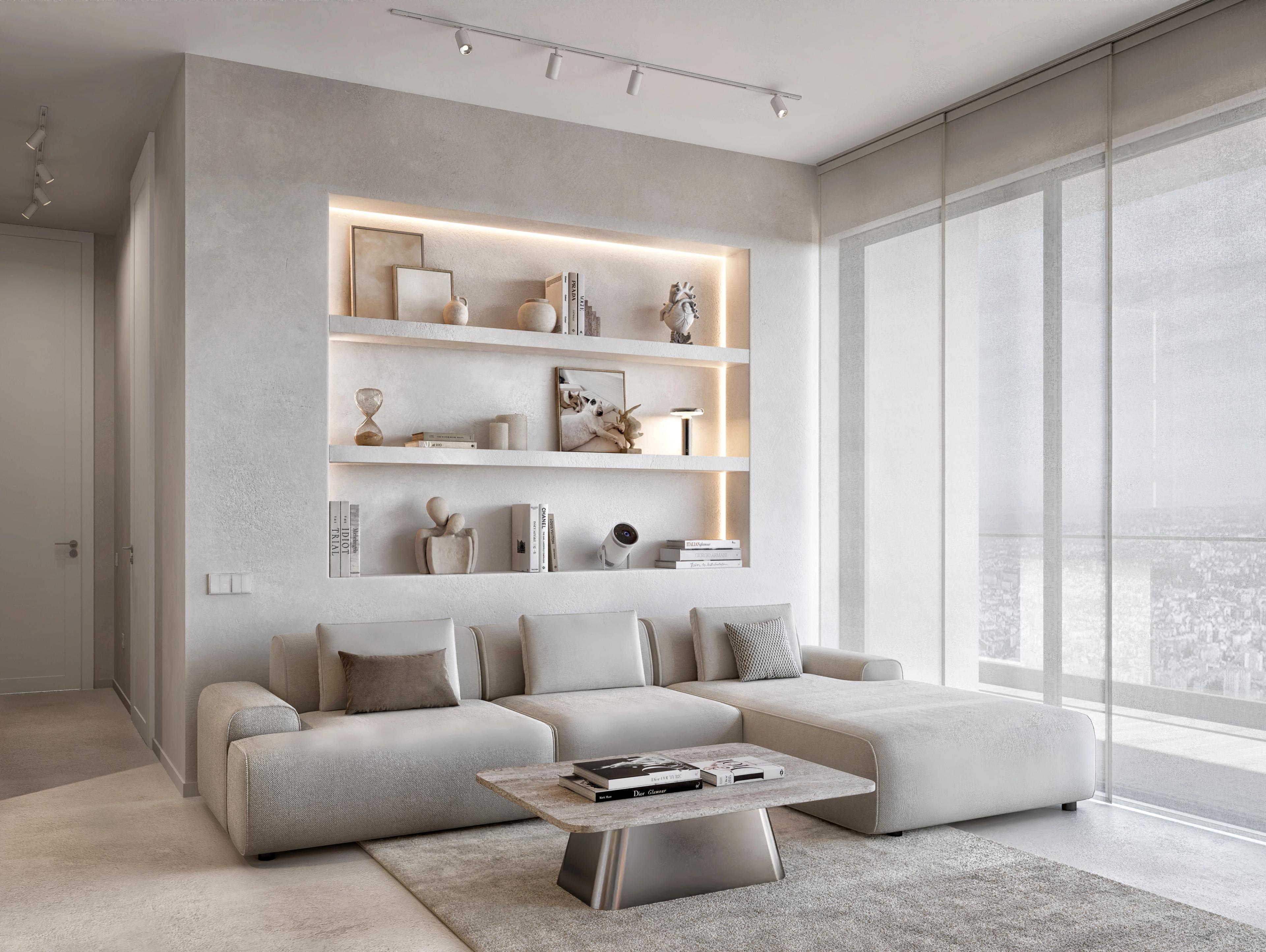 Living room with a cream sectional sofa, lit built-in shelving and floor-to-ceiling windows