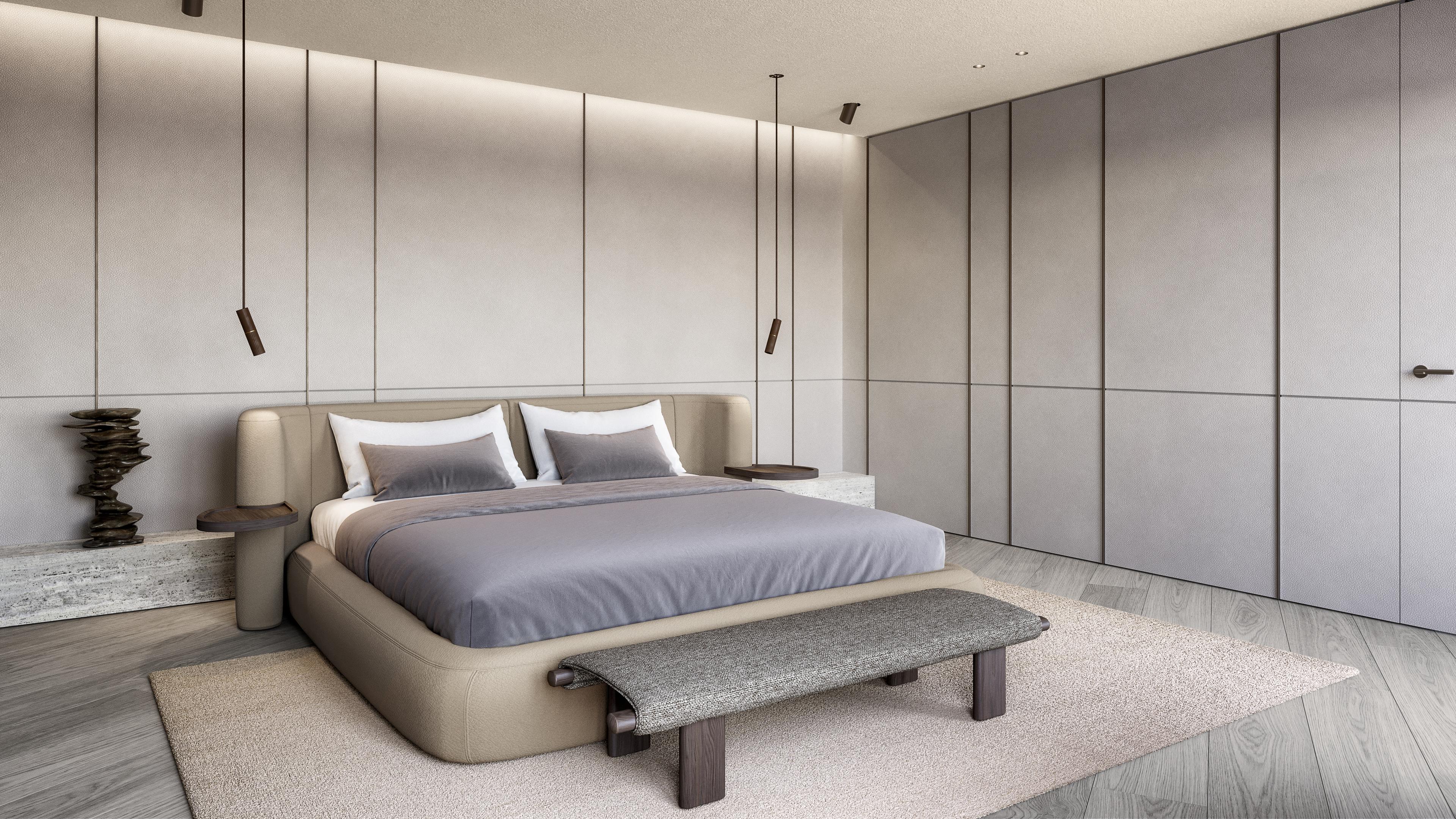 Bedroom with an upholstered bed, hanging pendants and grey padded wall panels