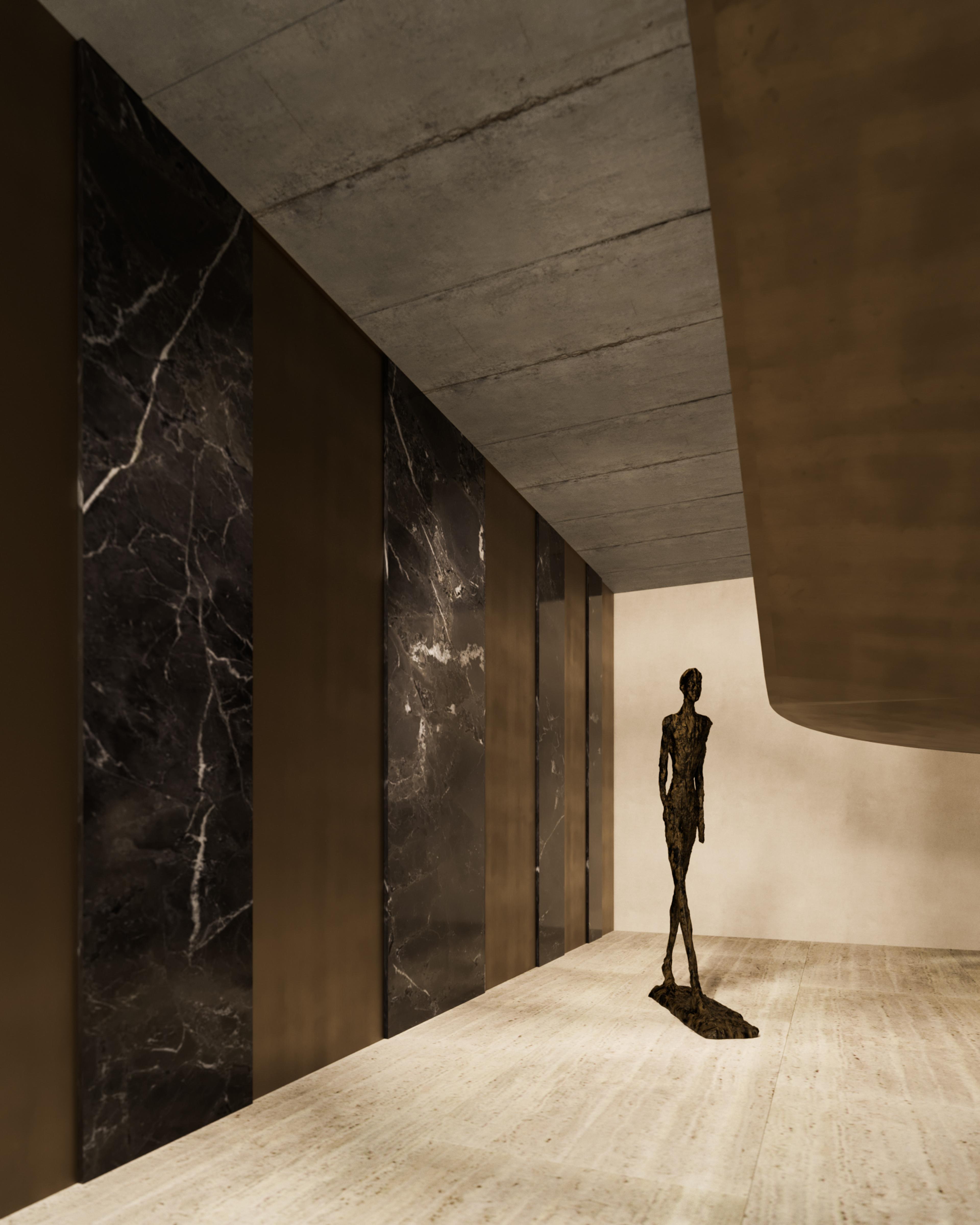 Entrance hall with black marble panels, bronze cladding and a bronze figure sculpture