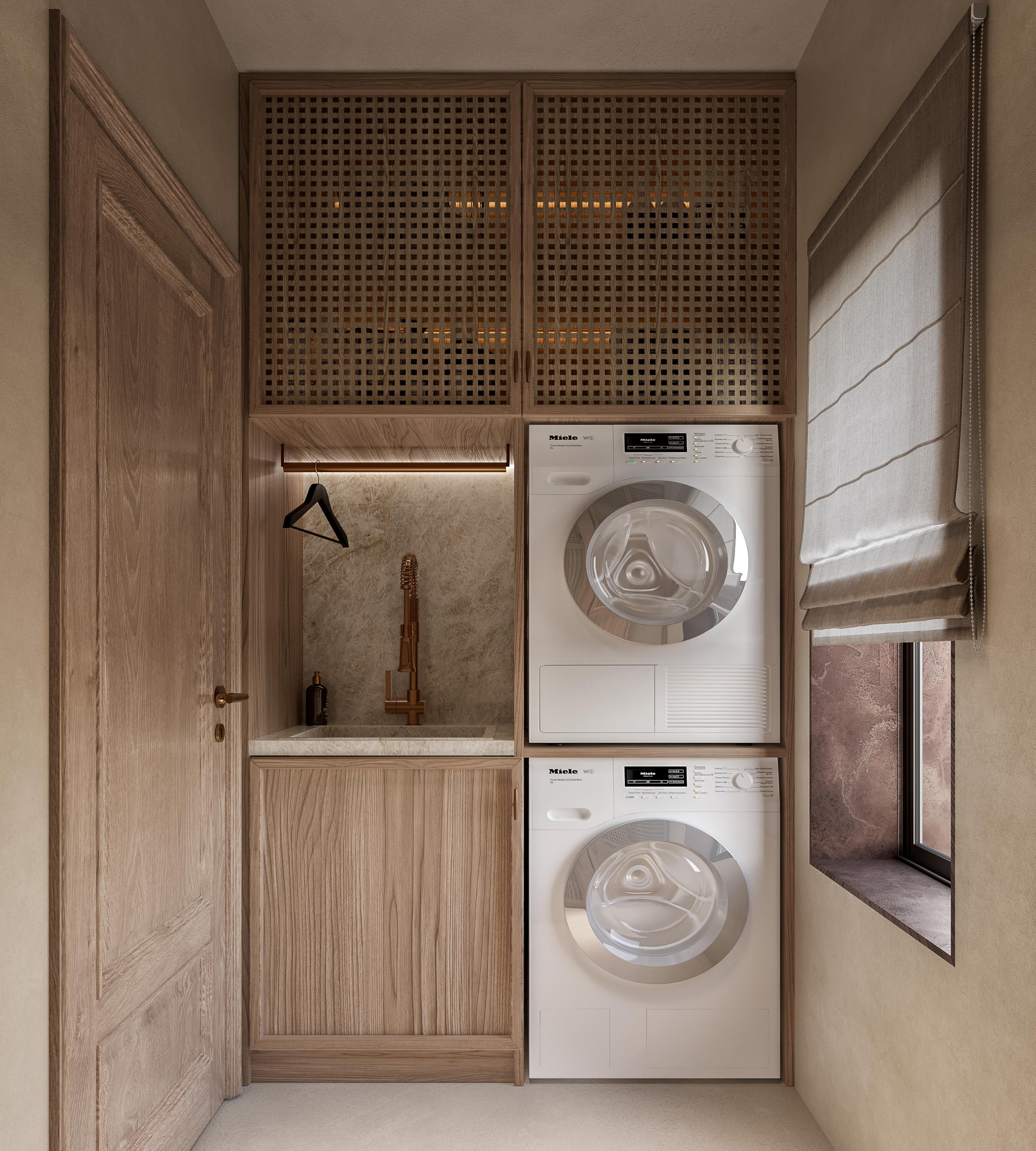 Laundry room with stacked washer and dryer and rattan-fronted cabinets
