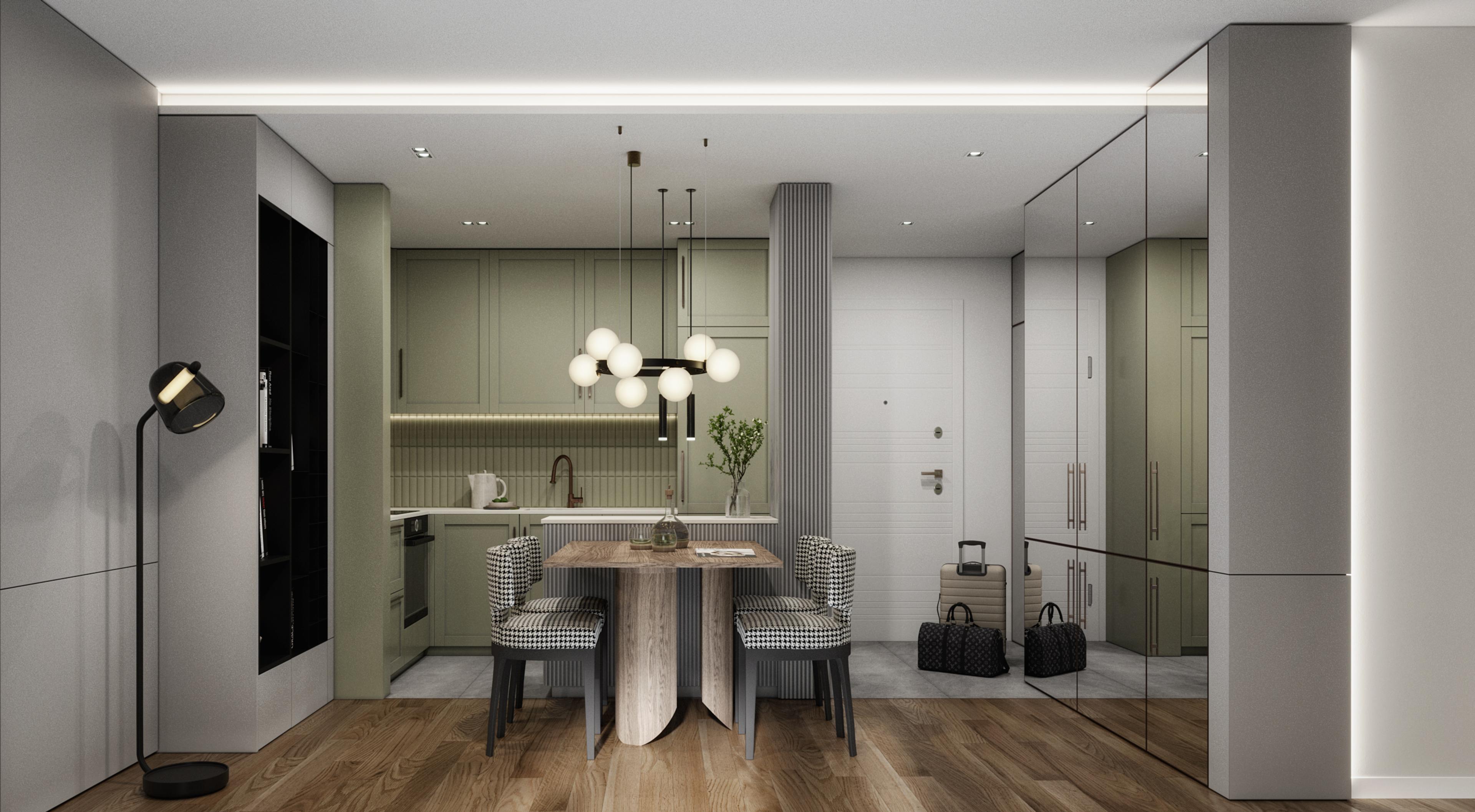 Entrance and kitchen with sage green cabinets, mirrored wall and a round dining table