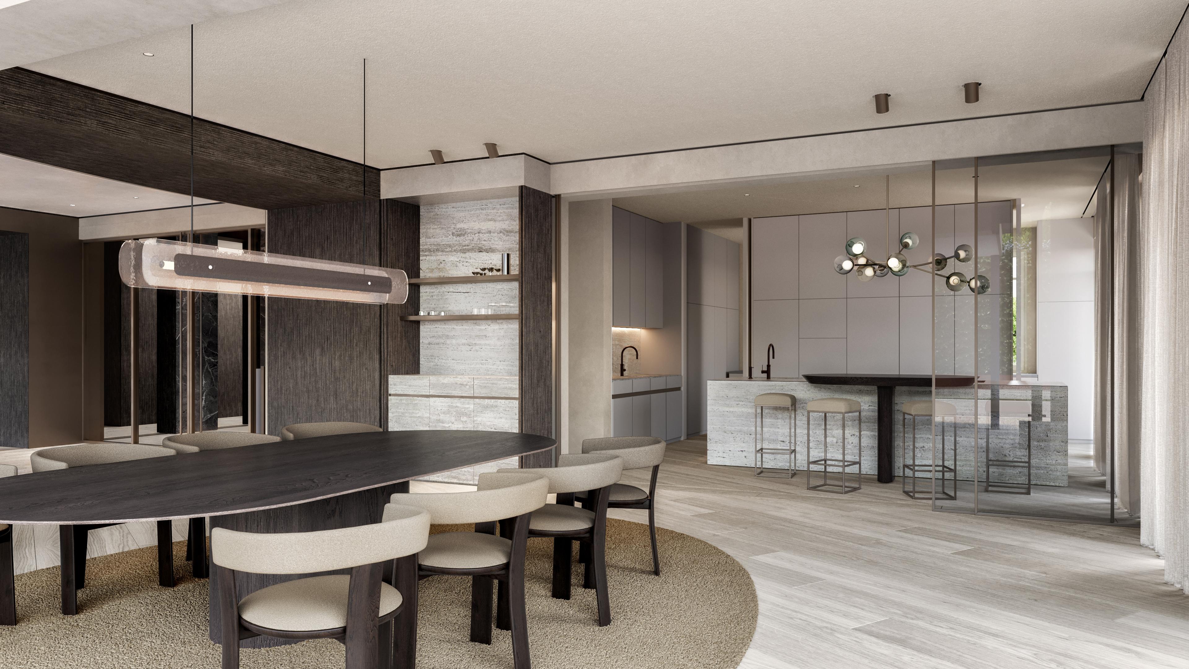 Dining area with an oval dark table and a kitchen island with stools behind