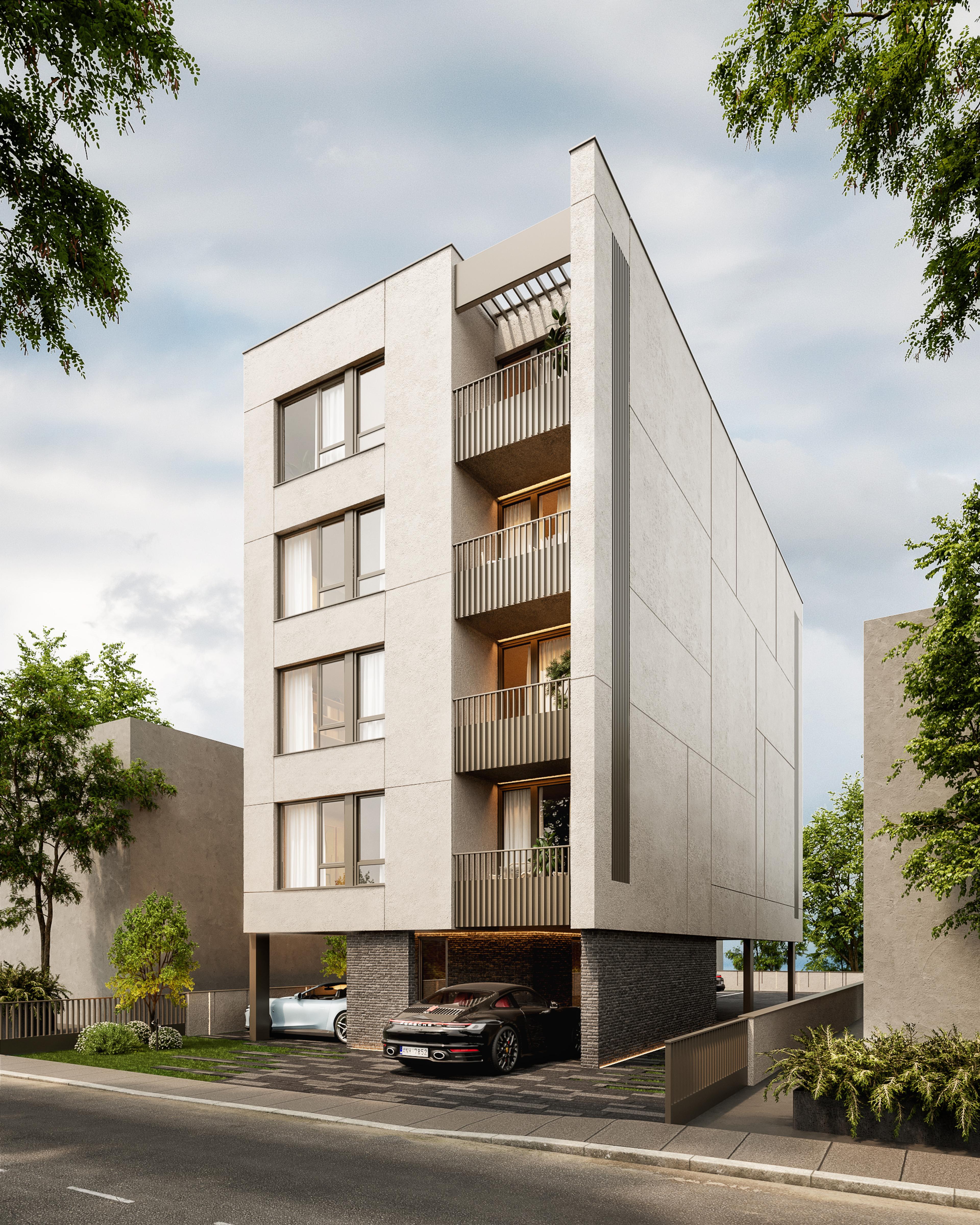 Apartment building on a corner plot with a ramped car entrance and planting along the pavement