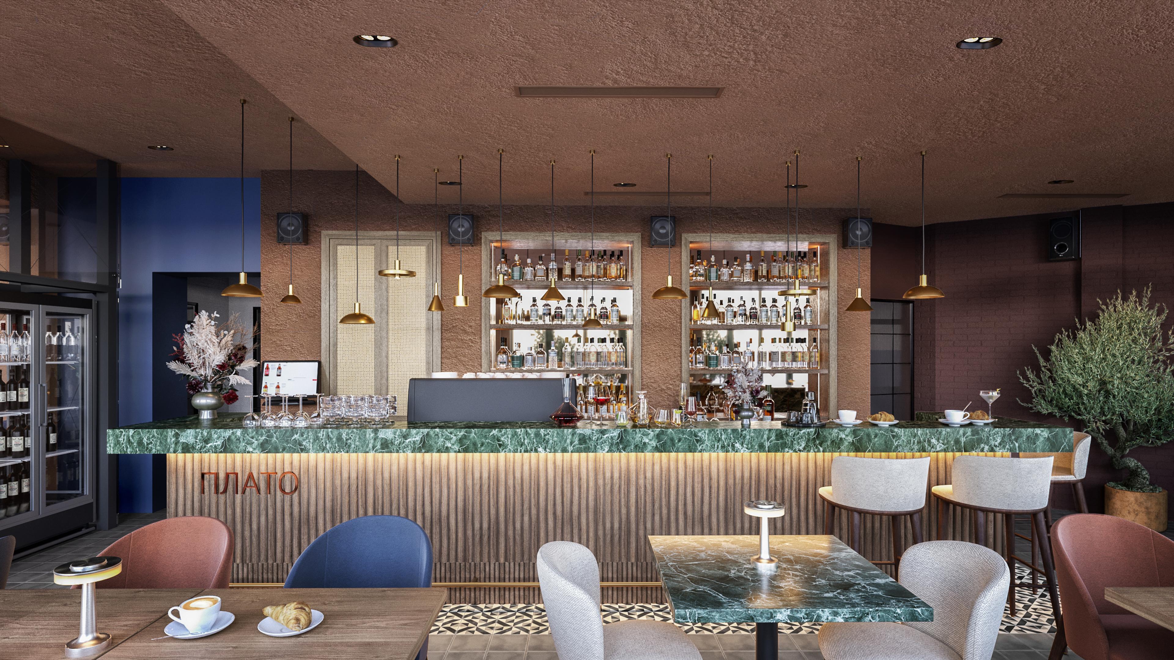 Restaurant bar with a green marble counter, fluted wood front and pendant lights
