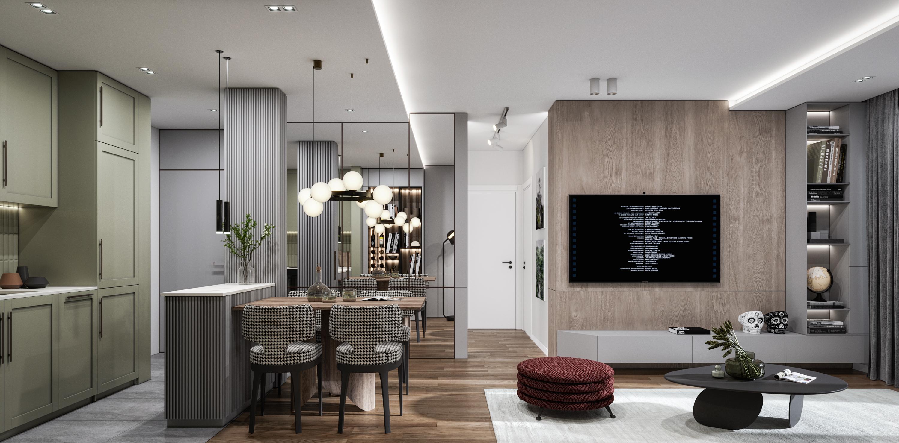 Living and dining area seen from the kitchen, with a wood-panelled TV wall and a grey sofa