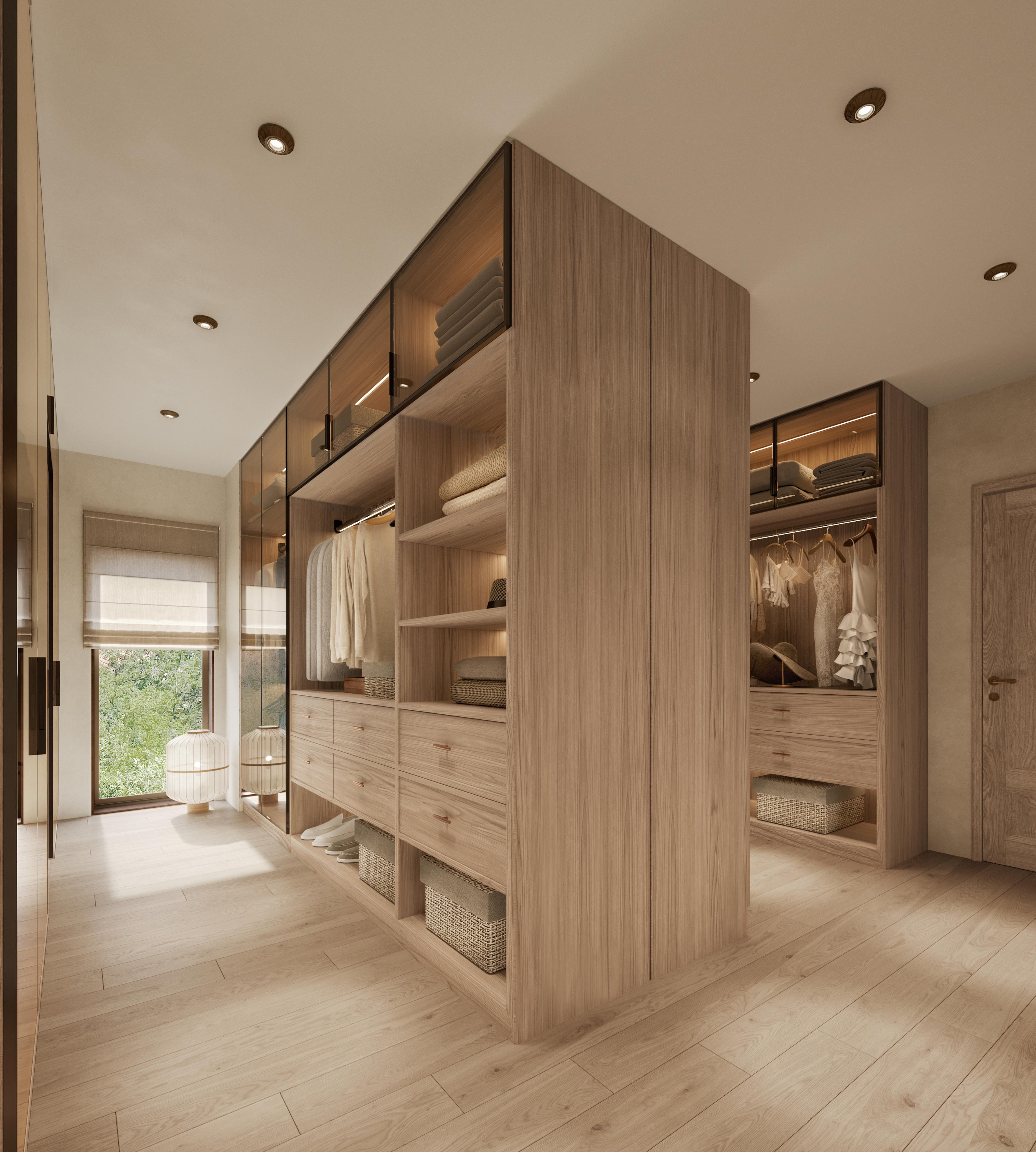 Dressing room with a central wooden storage block and a window to the garden