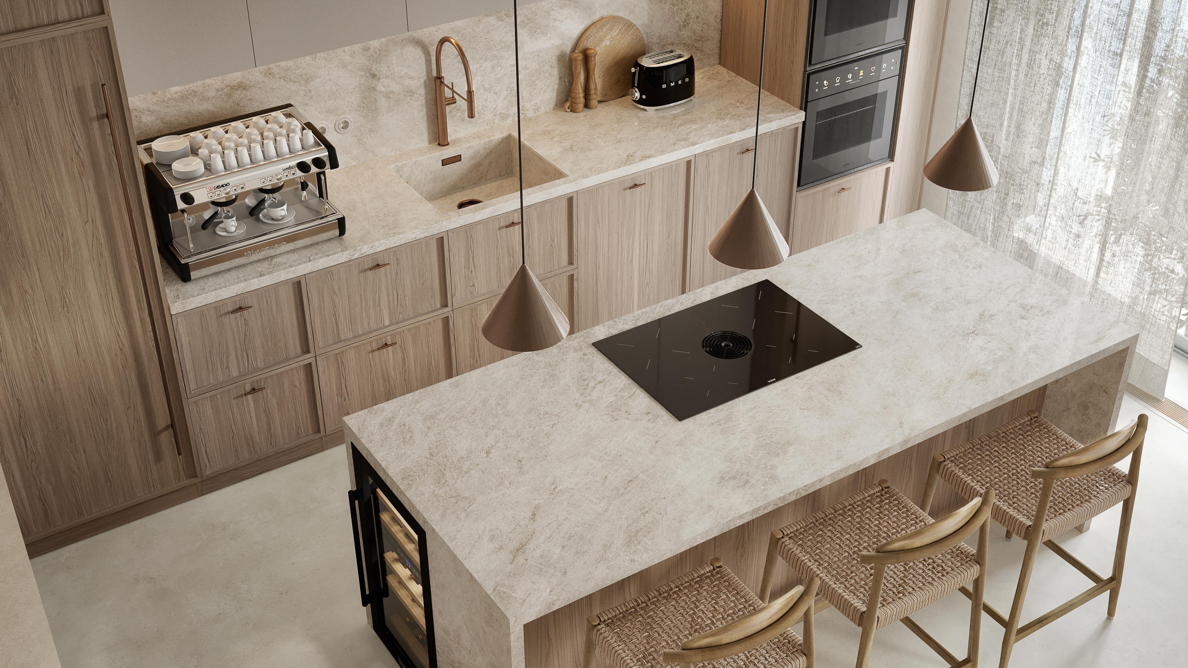 Kitchen island with a hob, a coffee machine on the counter and cone pendant lights above