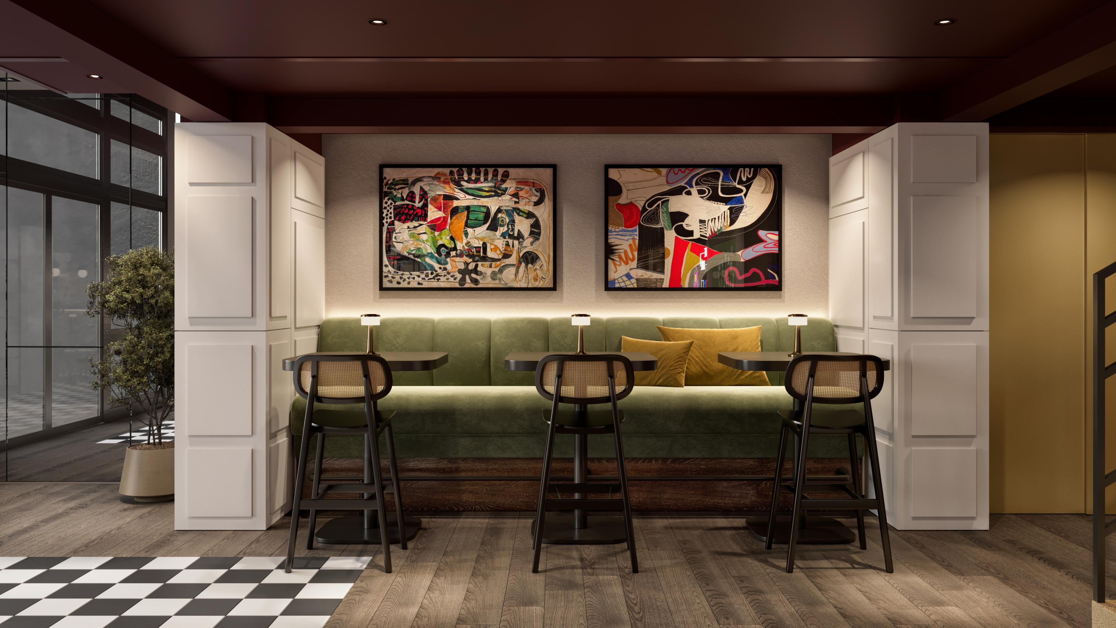 Green banquette seating with bar stools below colourful framed artworks