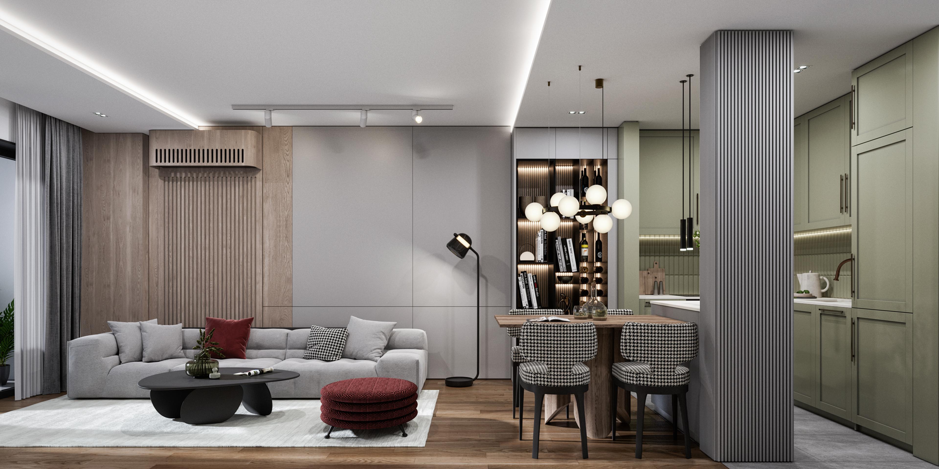 Open-plan living room with a grey sofa, burgundy ottoman, oak slat wall and sage green kitchen