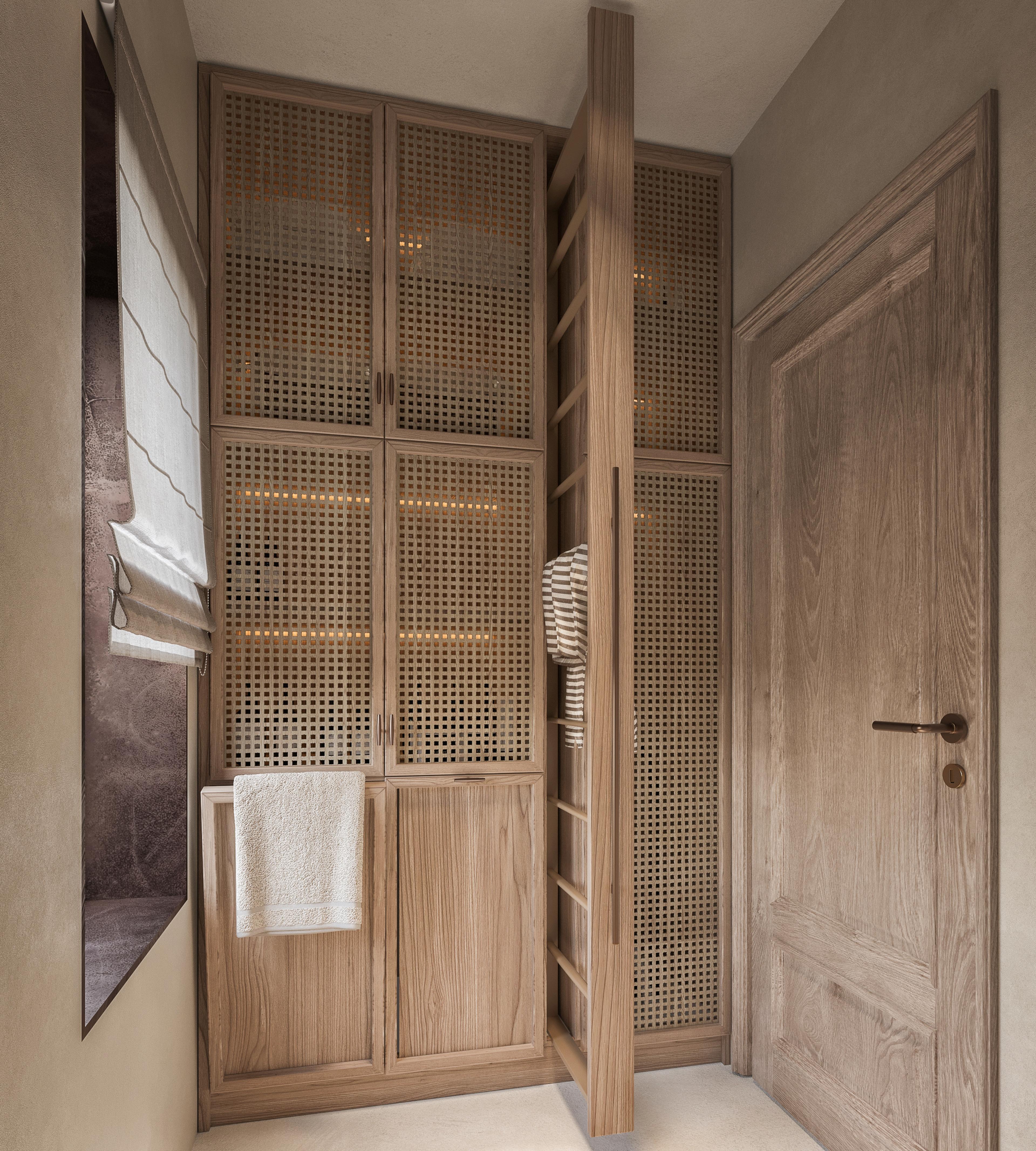 Laundry room cabinets with a towel rail and a timber door