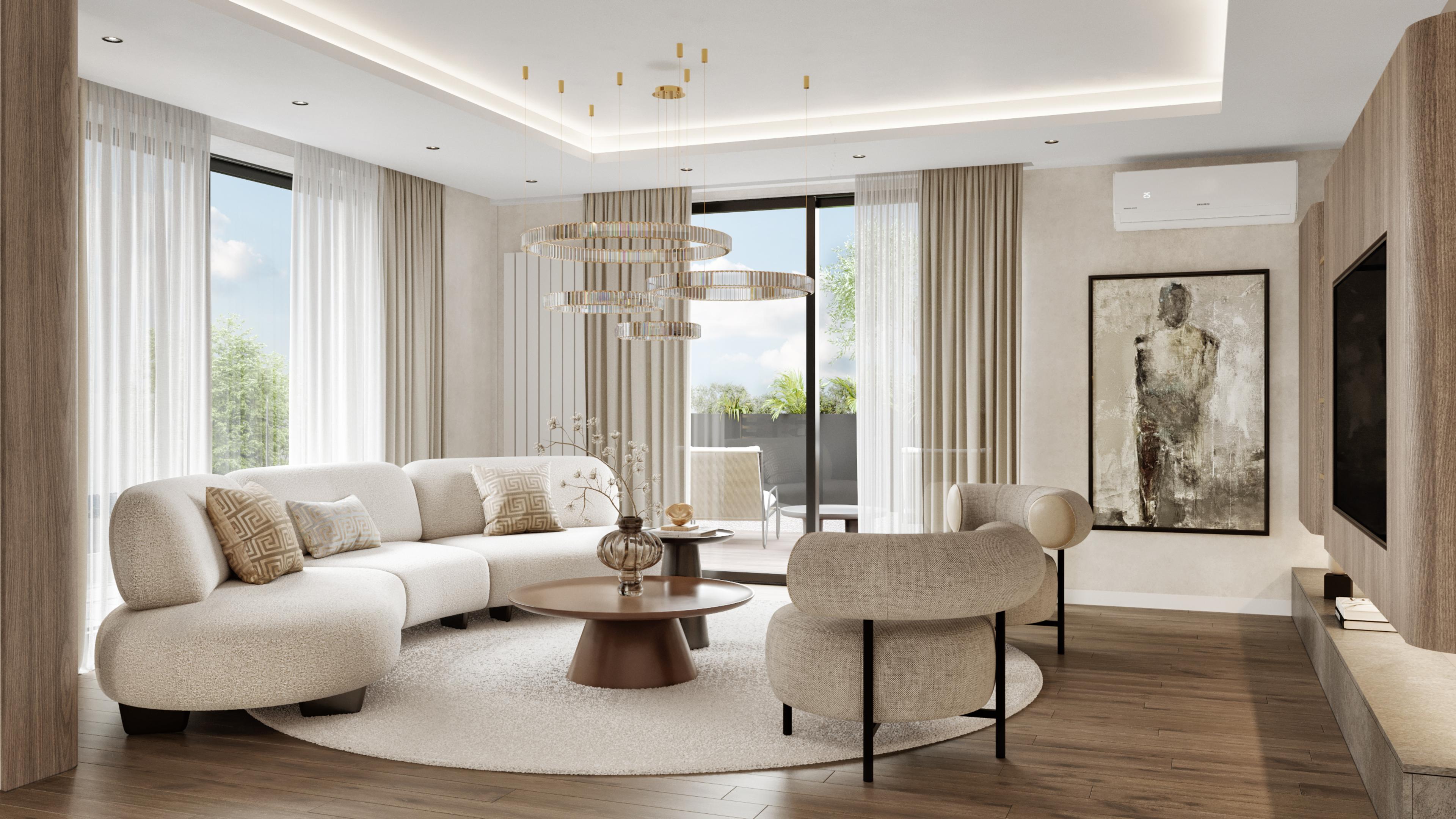Living room with a curved cream sofa, round coffee table and a framed figure artwork