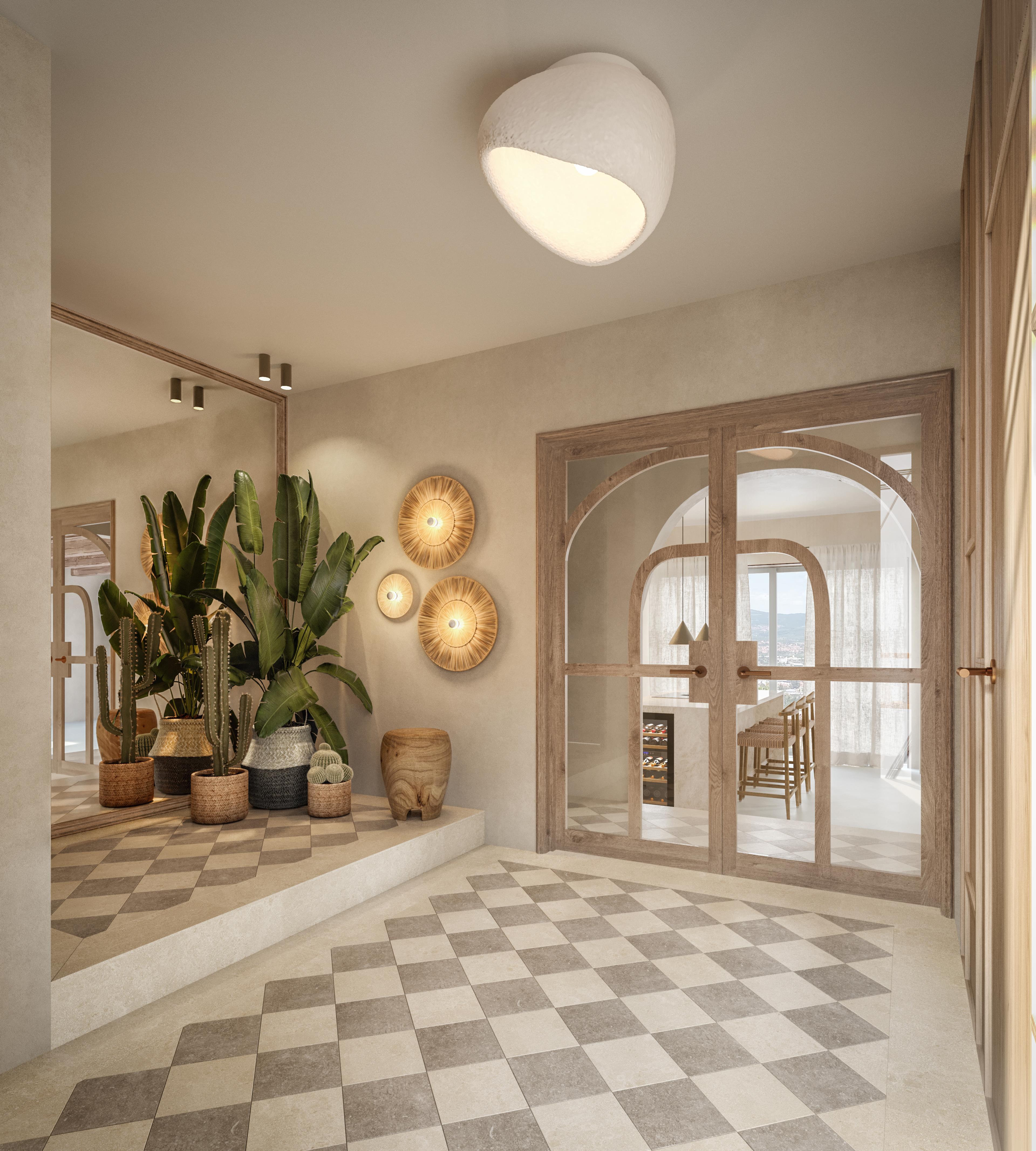 Entrance hall with a large leaf plant, arched glazed doors and a chequered floor