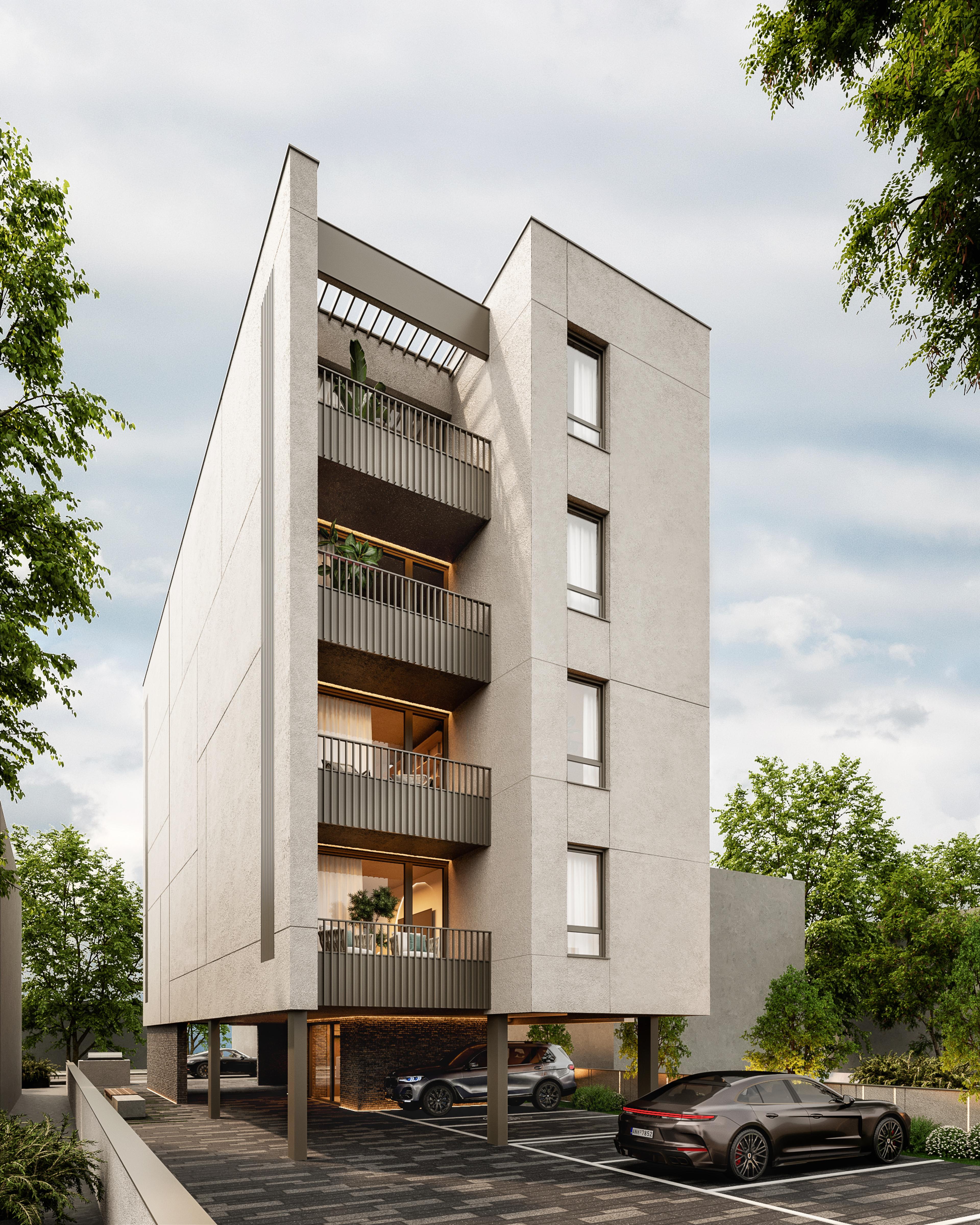 Apartment building with a pale cladded facade and ground-level parking, framed by trees