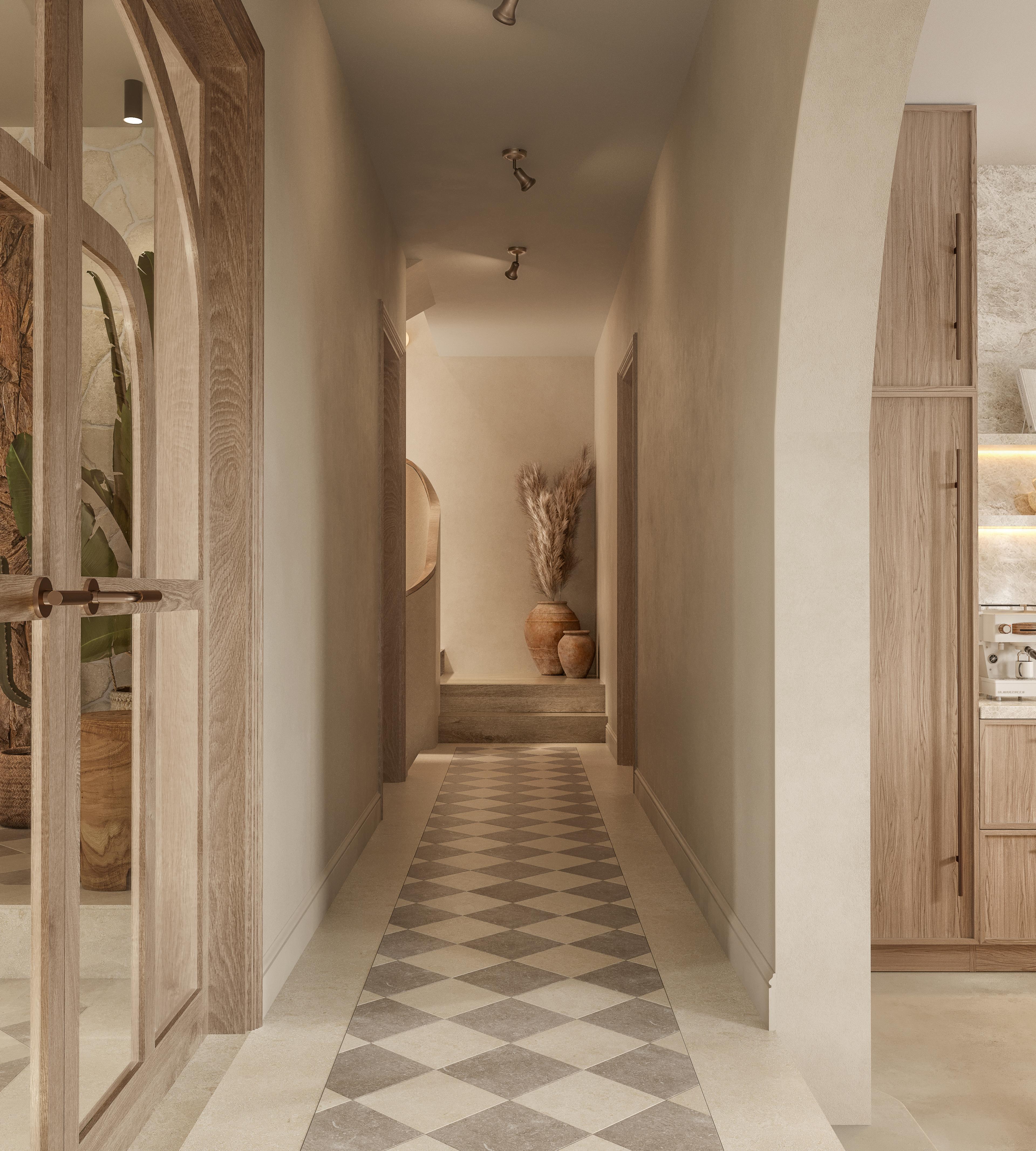 Hallway with a chequered stone floor, arched openings and glazed doors