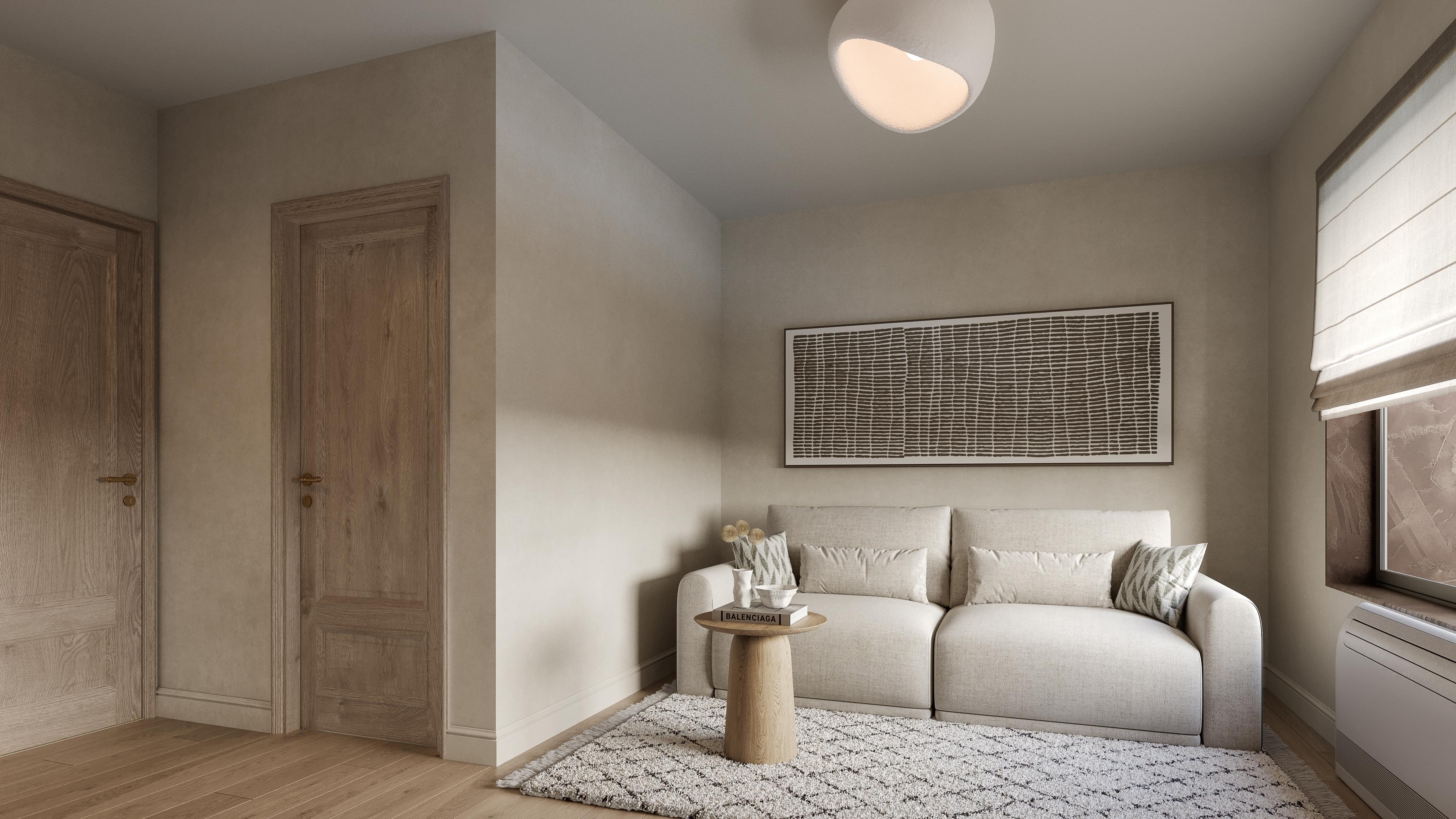 Guest room with a small sofa, a patterned rug and a framed textile artwork