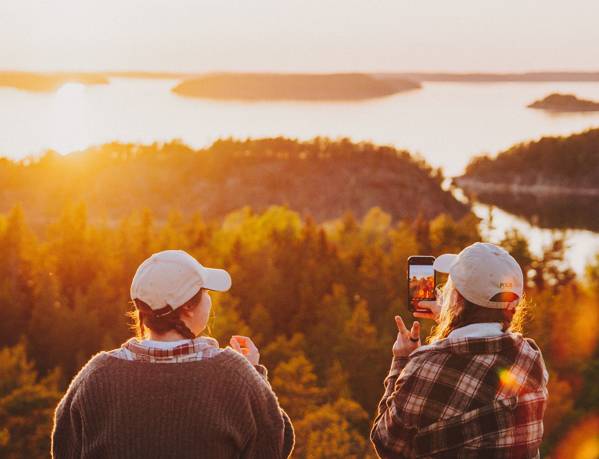 Two people enjoying an autumn view over the Finnish archipelago
