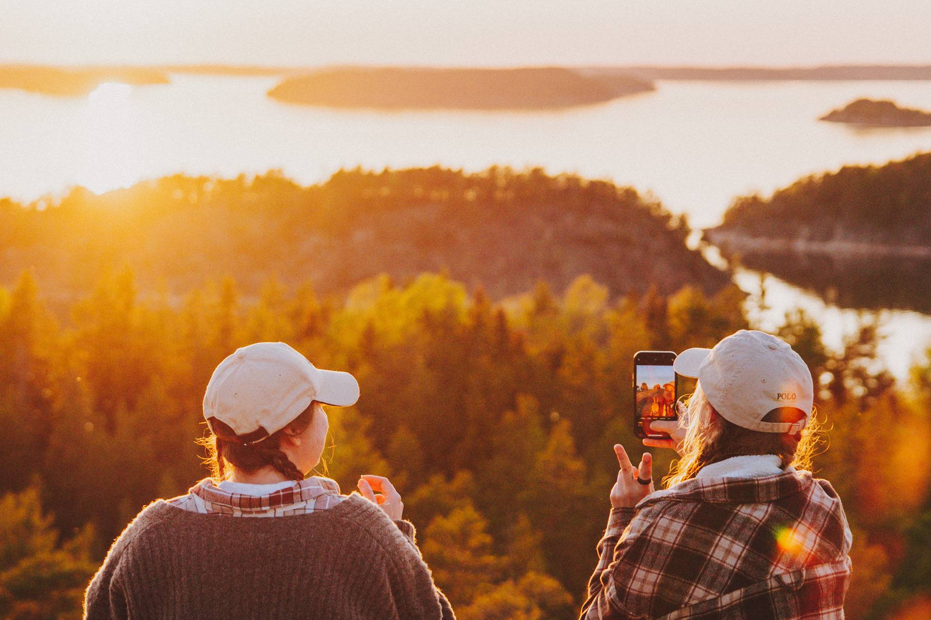 Two people enjoying an autumn view over the Finnish archipelago