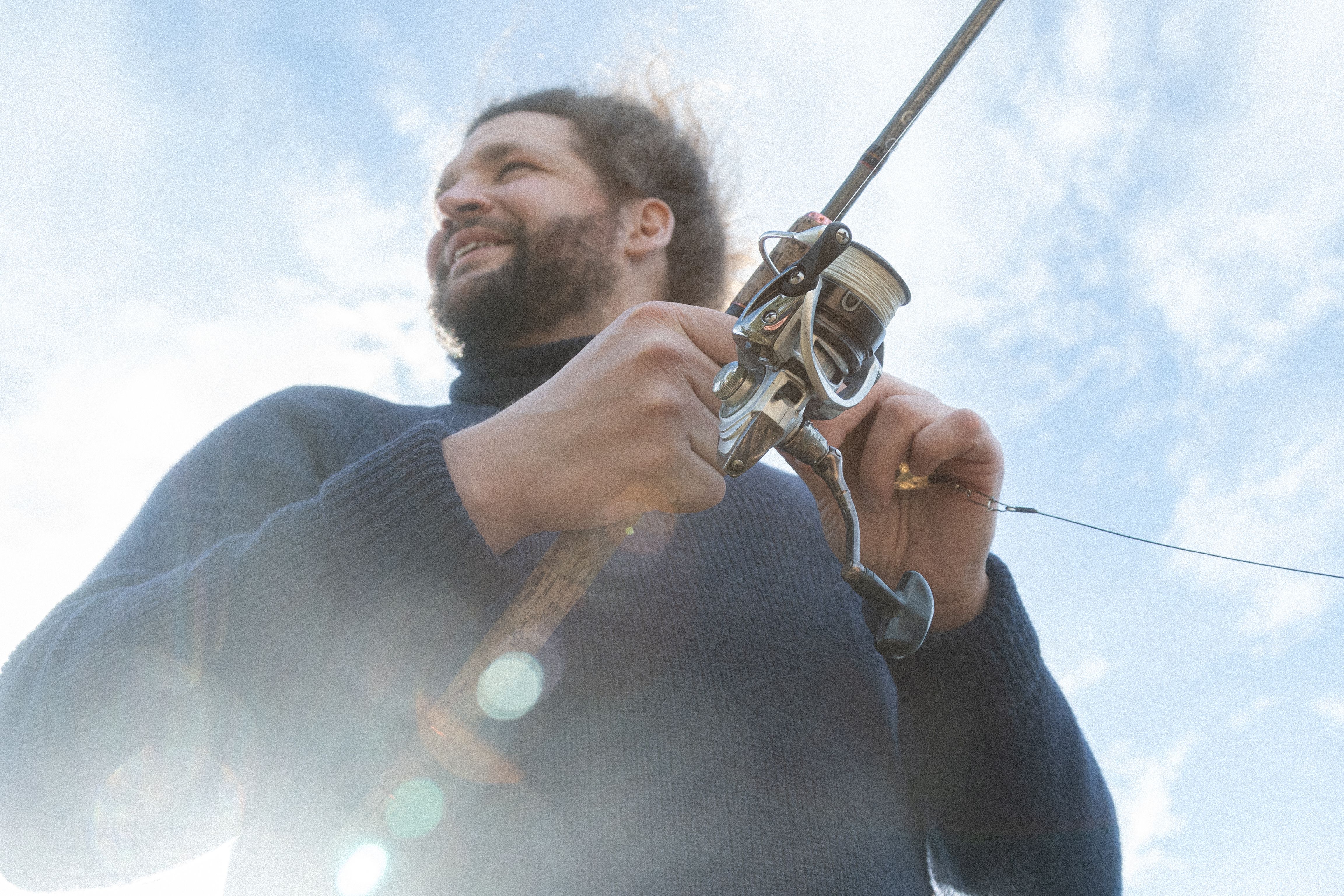 A man holding a fishing rod.