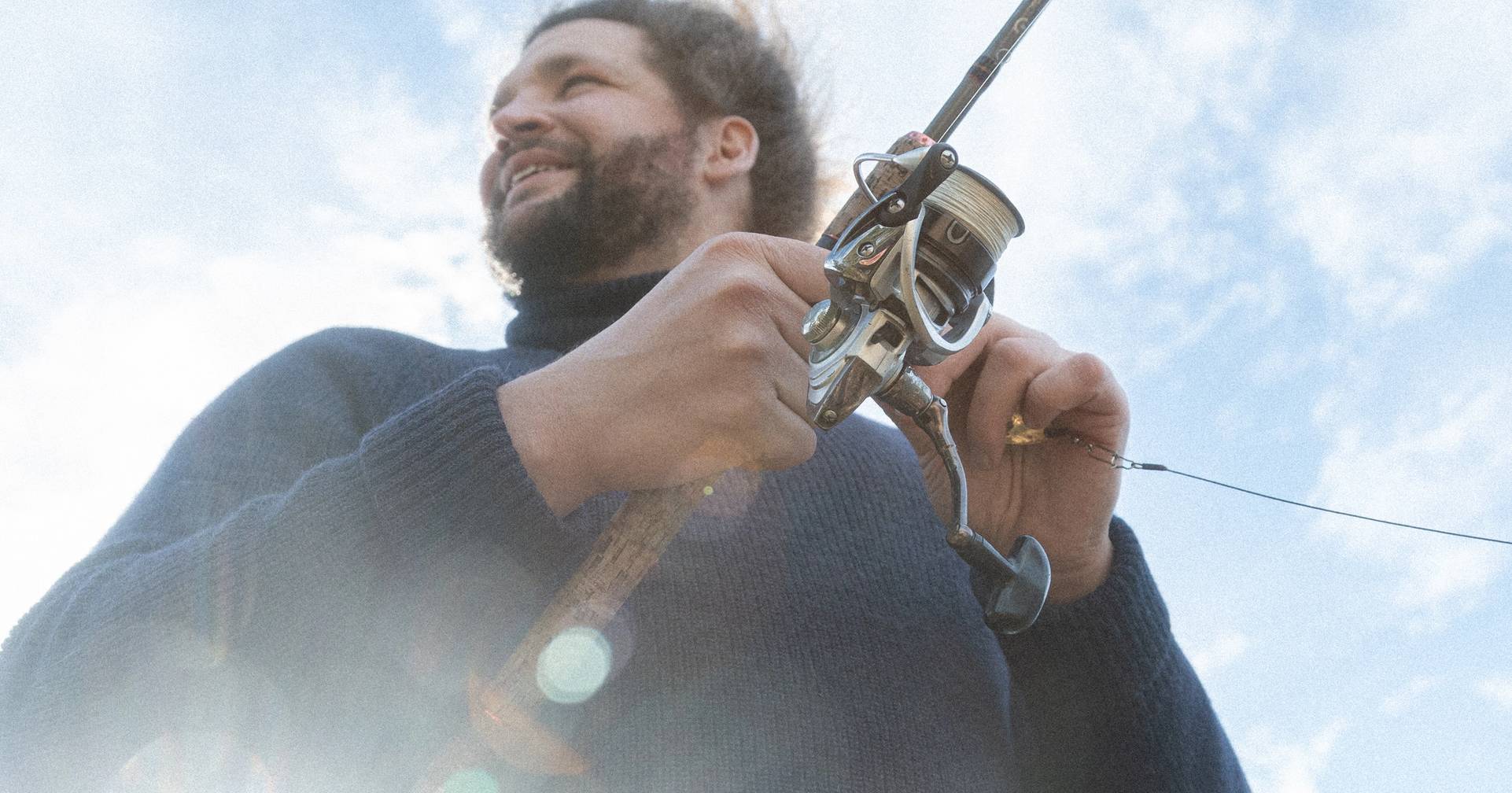 A person holding a fishing rod.