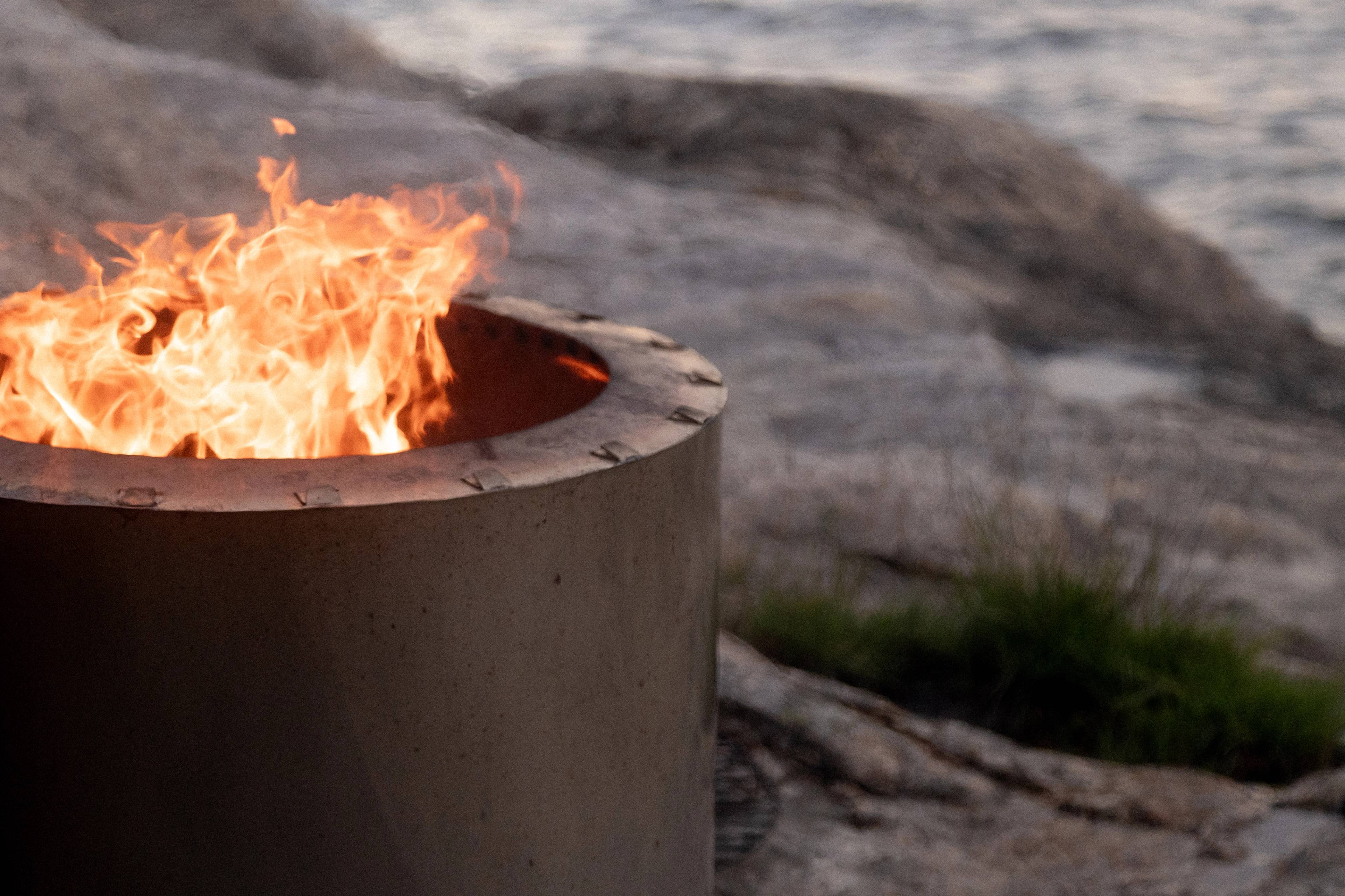 A small bonfire on the shore.