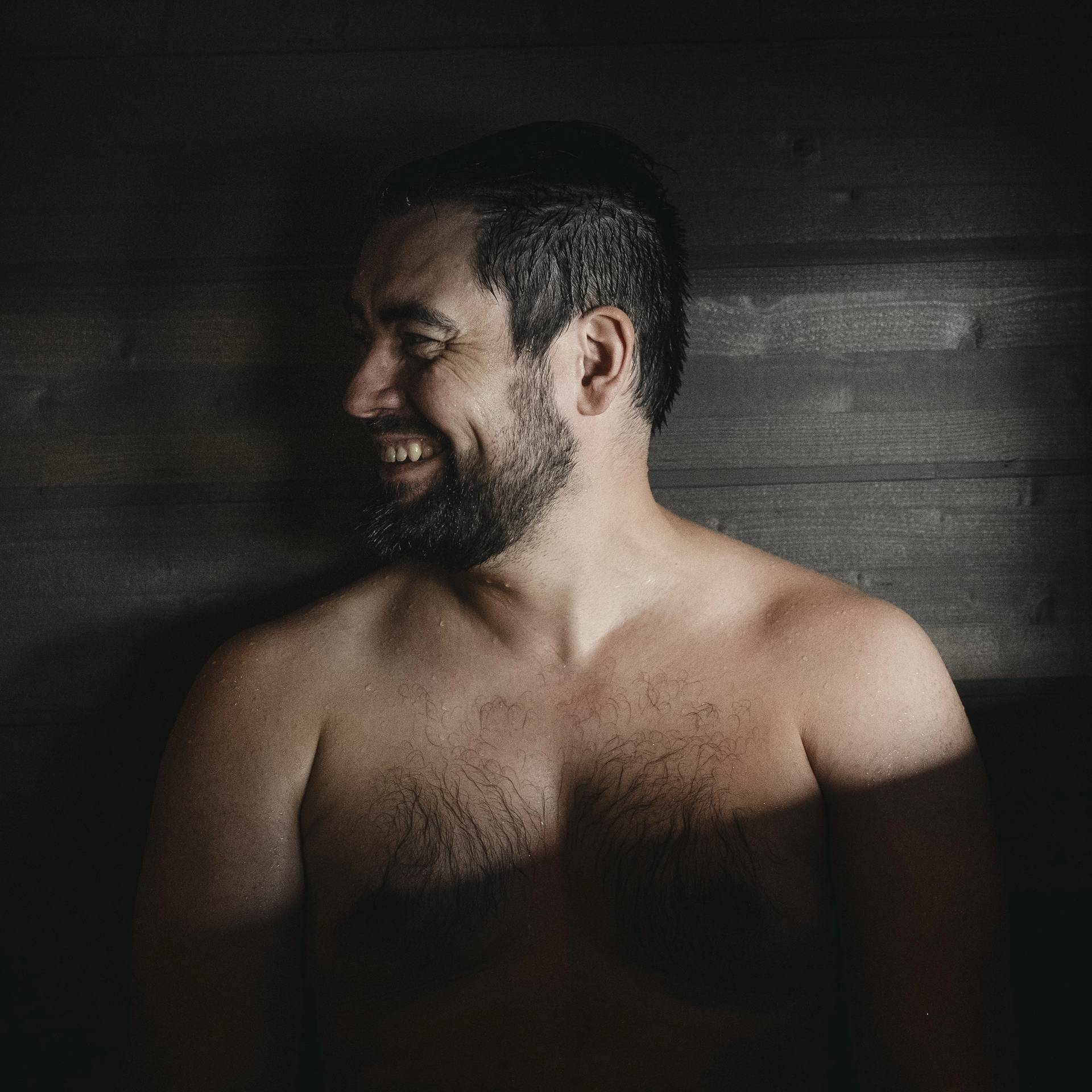A Finnish man in a sauna. At archipelago of Finland.