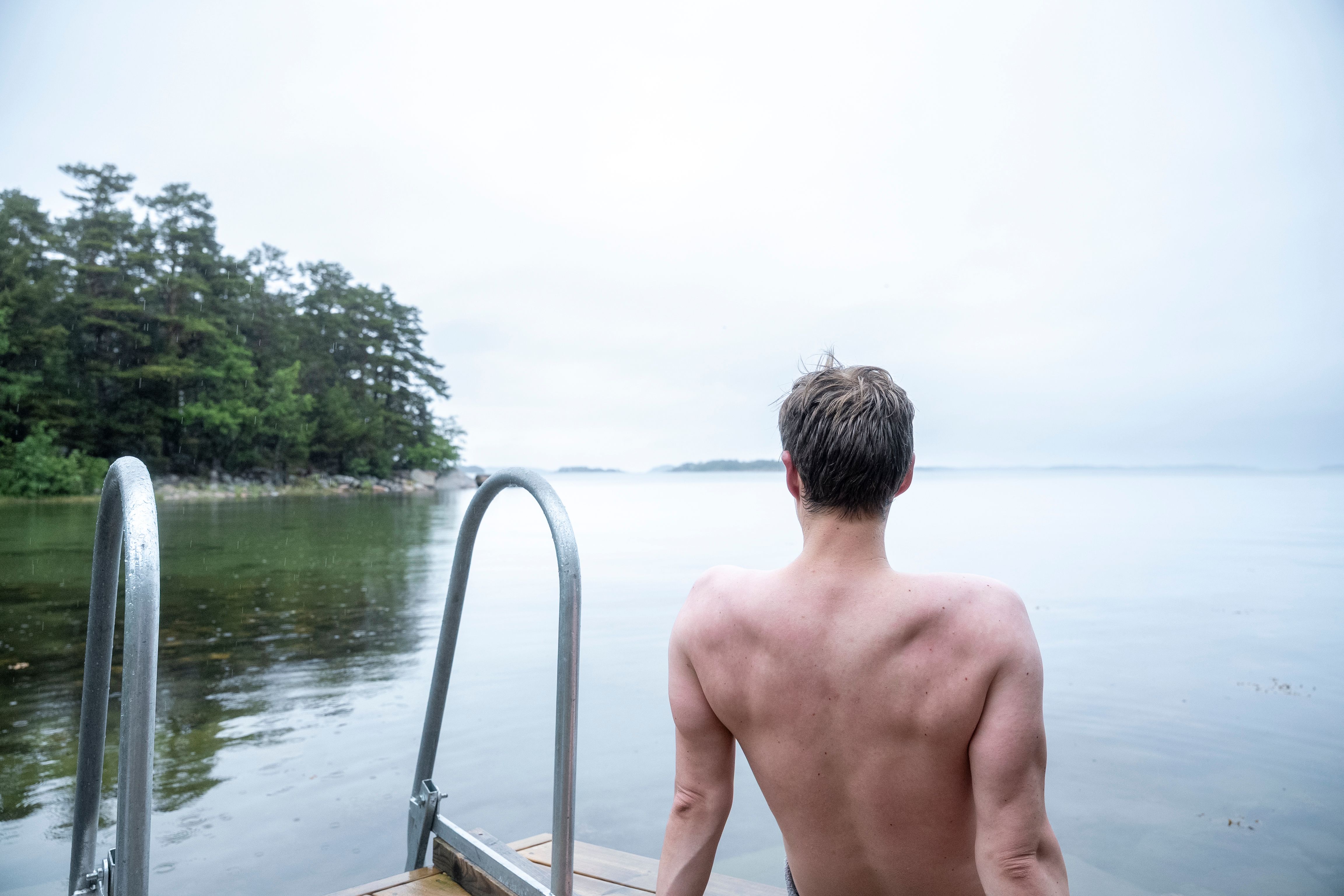 A person sitting by the shore.