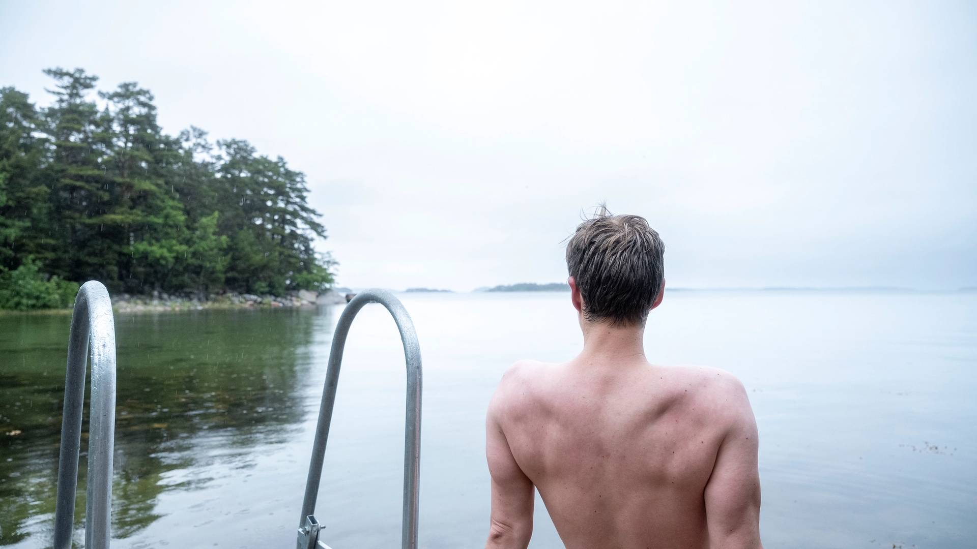 A person sitting by the shore.
