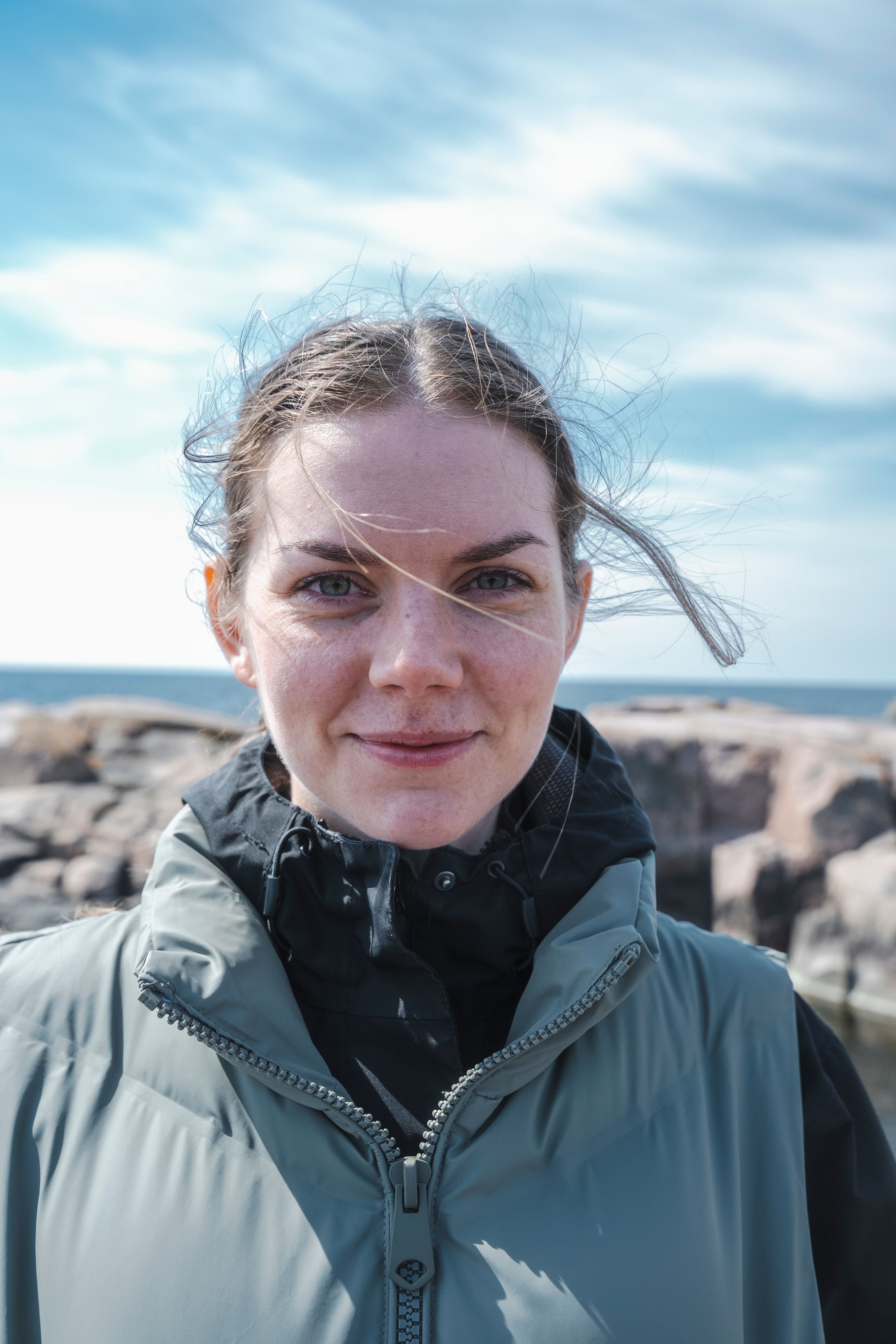 A woman smiling at the camera in the Finnish archipelago