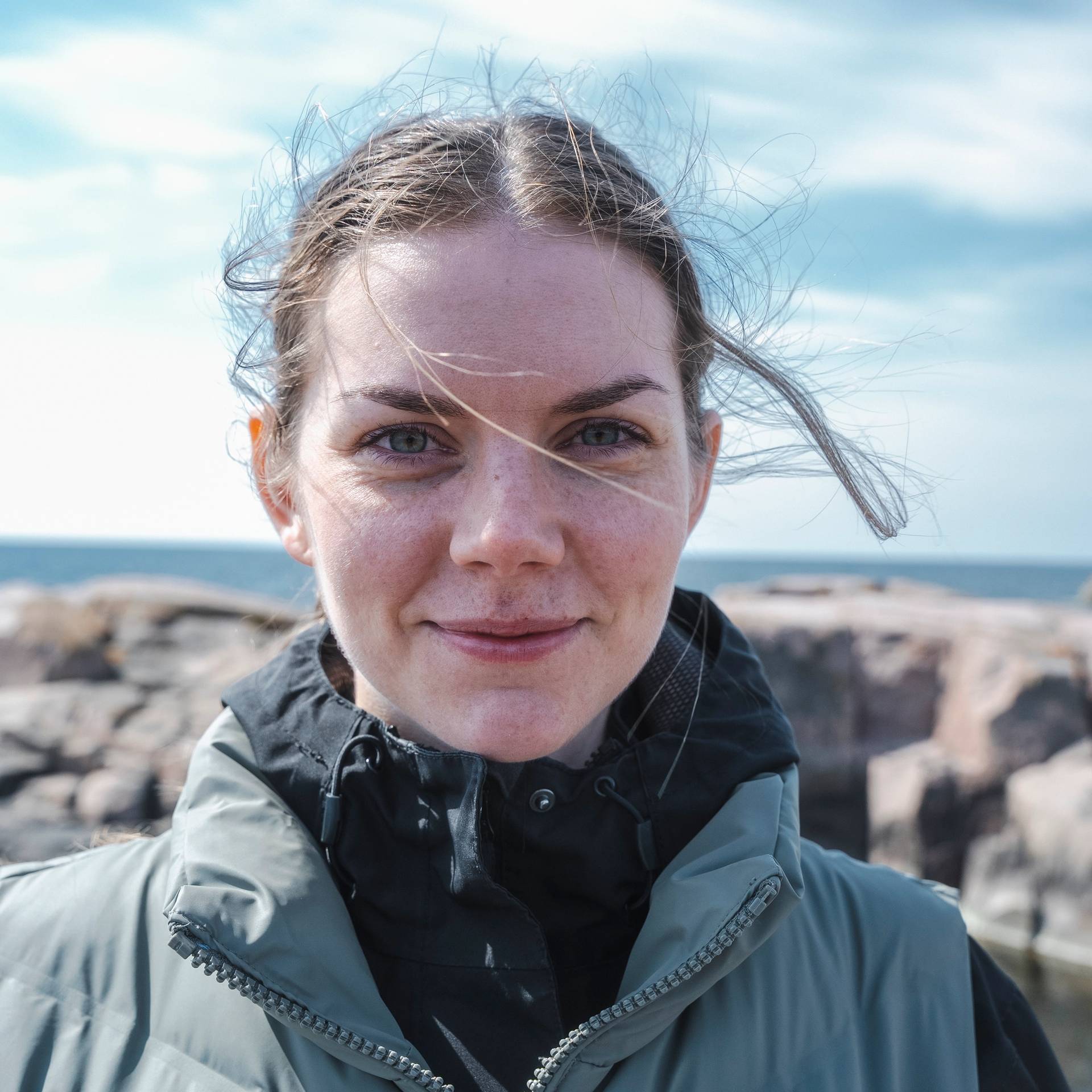 A woman smiling at the camera in the Finnish archipelago