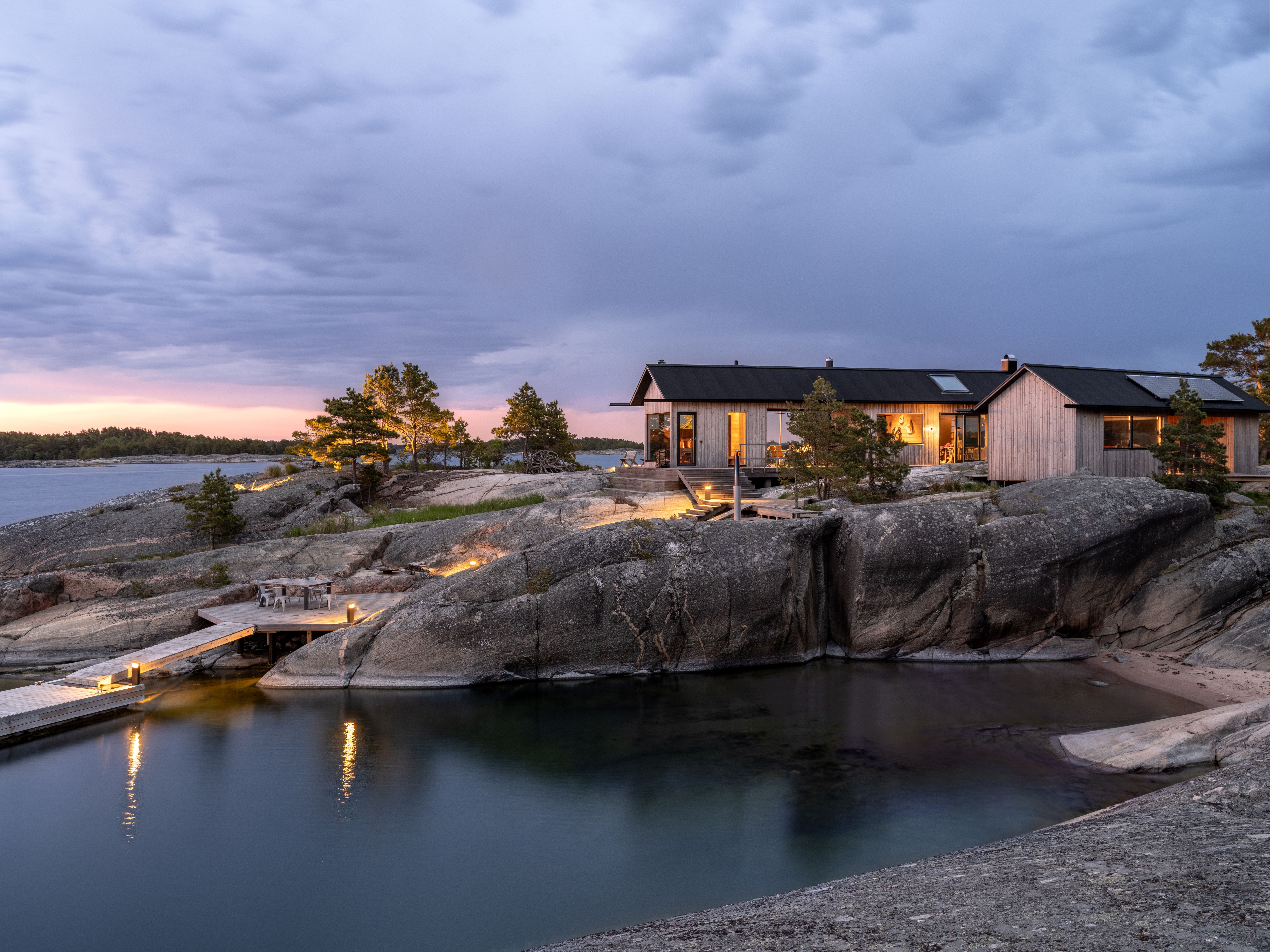 A stylish cabin with a big window.