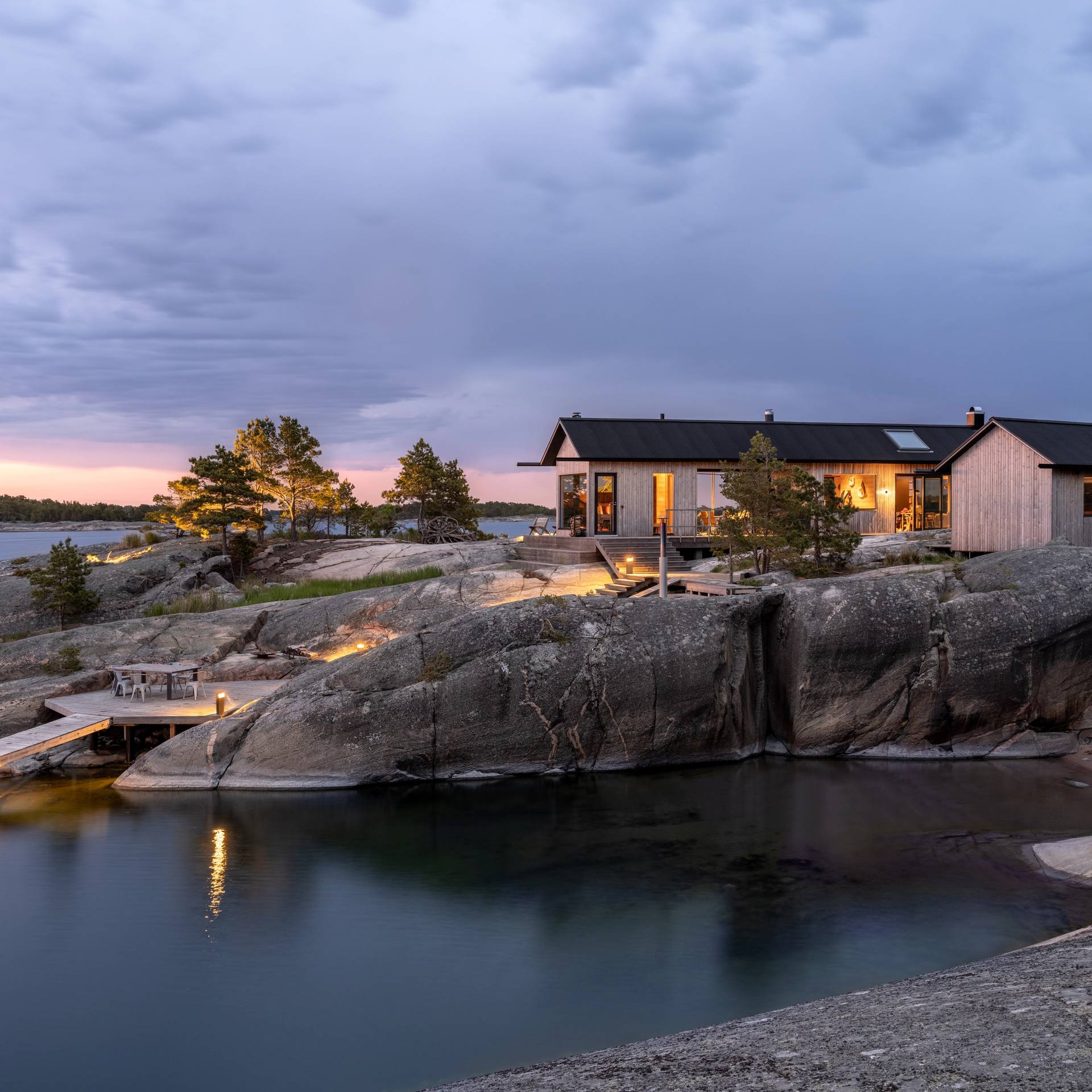 A stylish cabin with a big window.