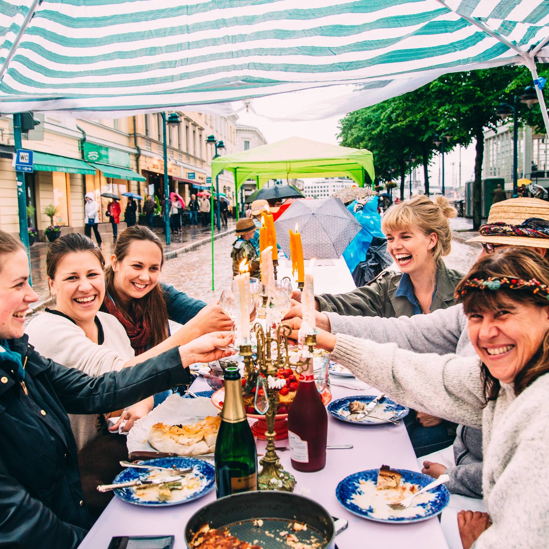 People eating and laughing in Helsinki.