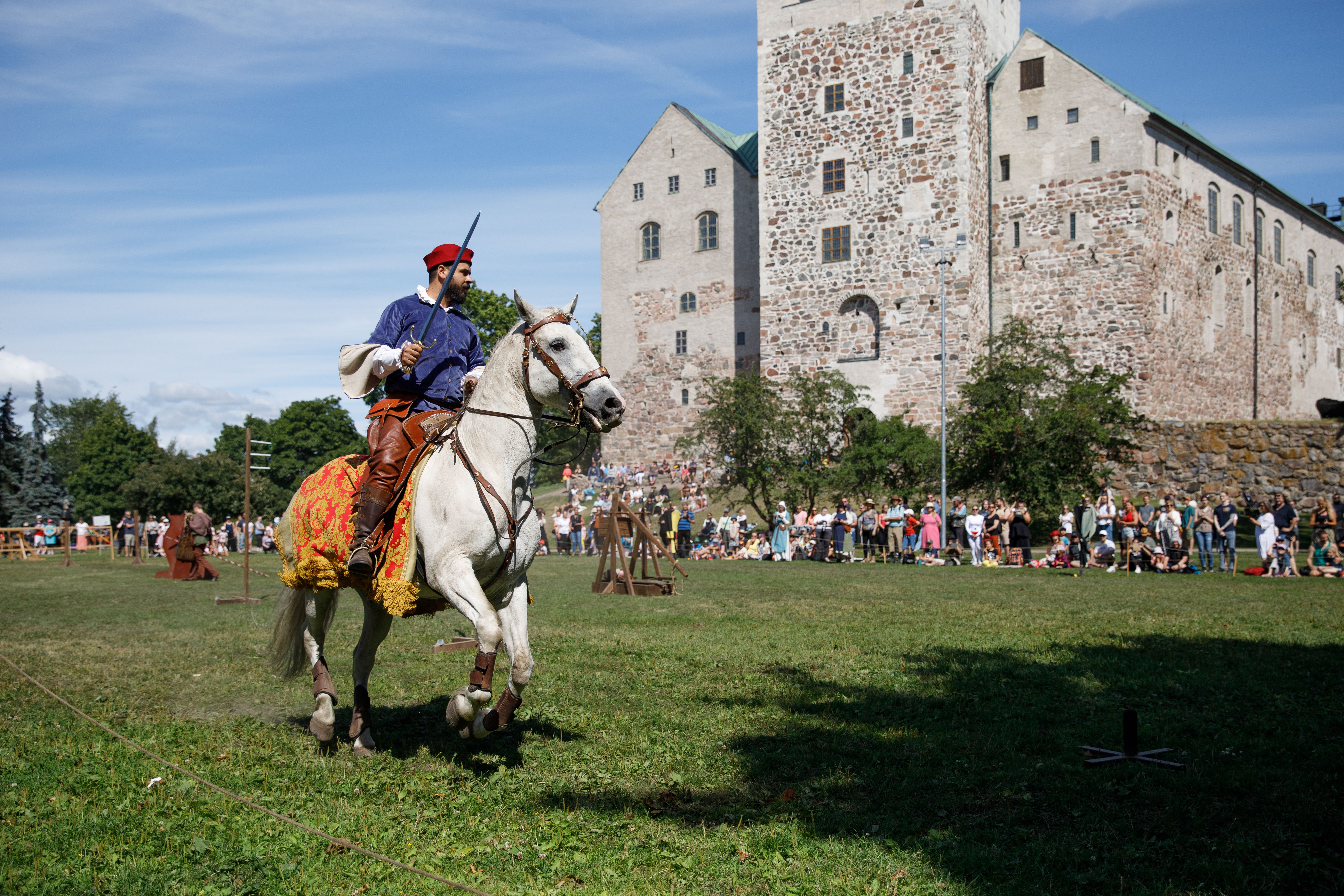 A horse rider on the yard of the Turku Castle.